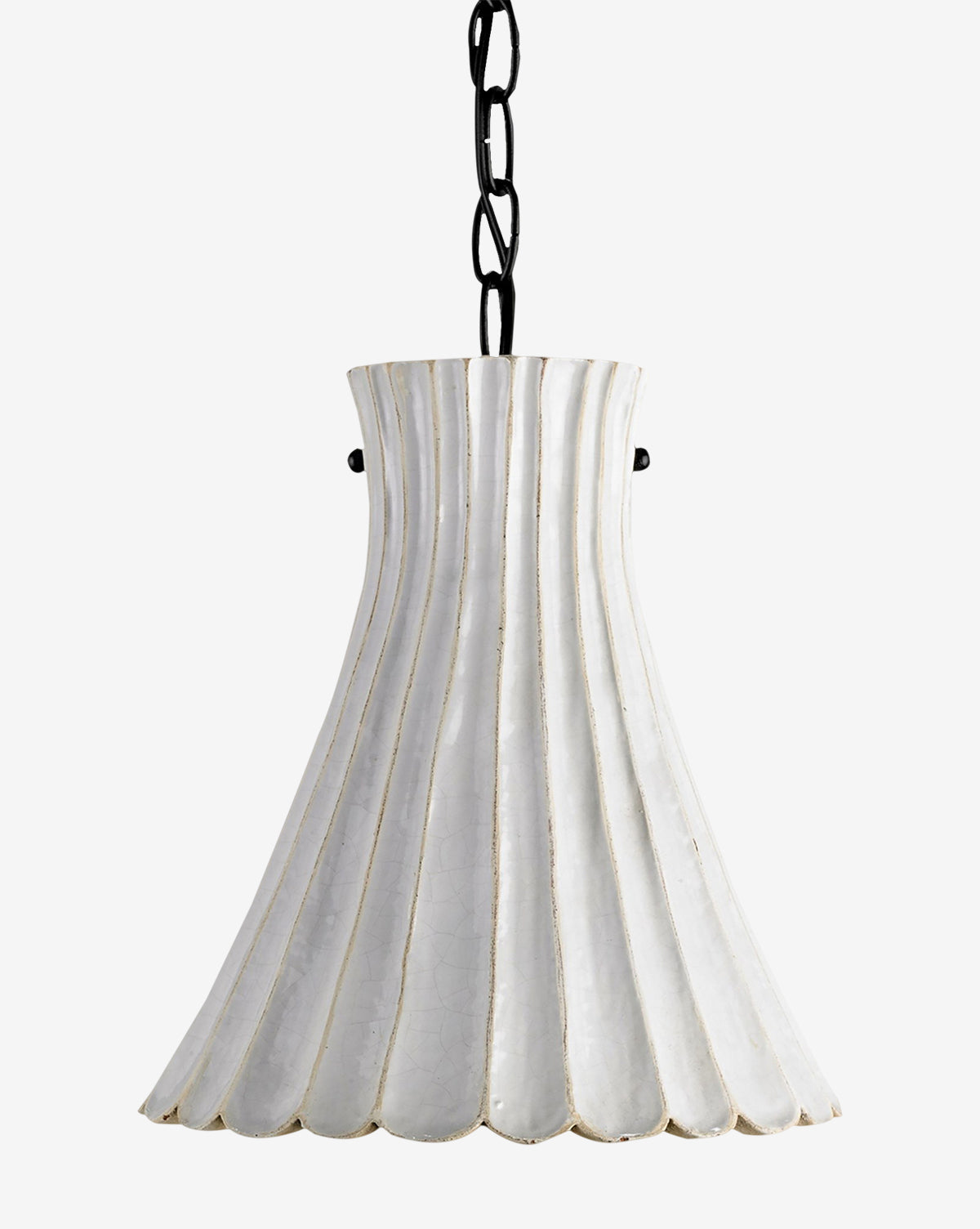 The Jazz Pendant features a fluted, bell-shaped white ceramic shade suspended by a black metal chain, creating a retro design statement against any plain light background, by McGee & Co.