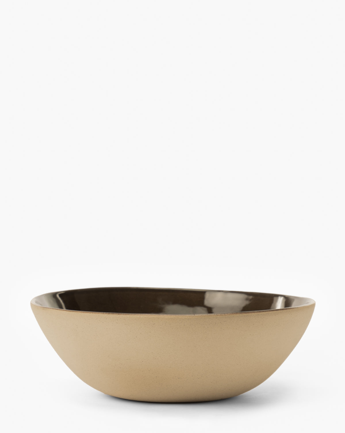 The Joanne Serving Bowl is a beige ceramic bowl featuring a glossy espresso glaze interior, displayed on a plain white background by McGee & Co.