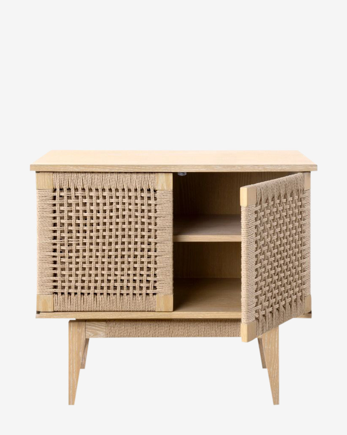 The Jovan Cabinet features a light oak finish, two woven rope cabinet doors (one open to show an adjustable shelf and extra storage), and stands on four angled legs, by McGee & Co.