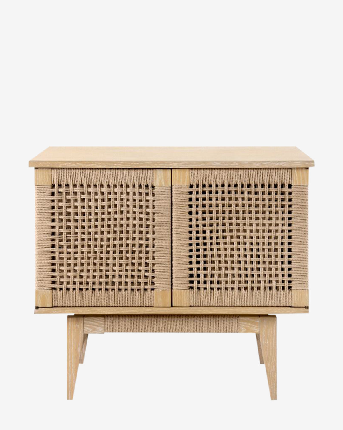 The Jovan Cabinet is a minimalist wooden side table with woven rope panels, a natural light wood finish, elevated legs, and an adjustable shelf for versatile storage, by McGee & Co.
