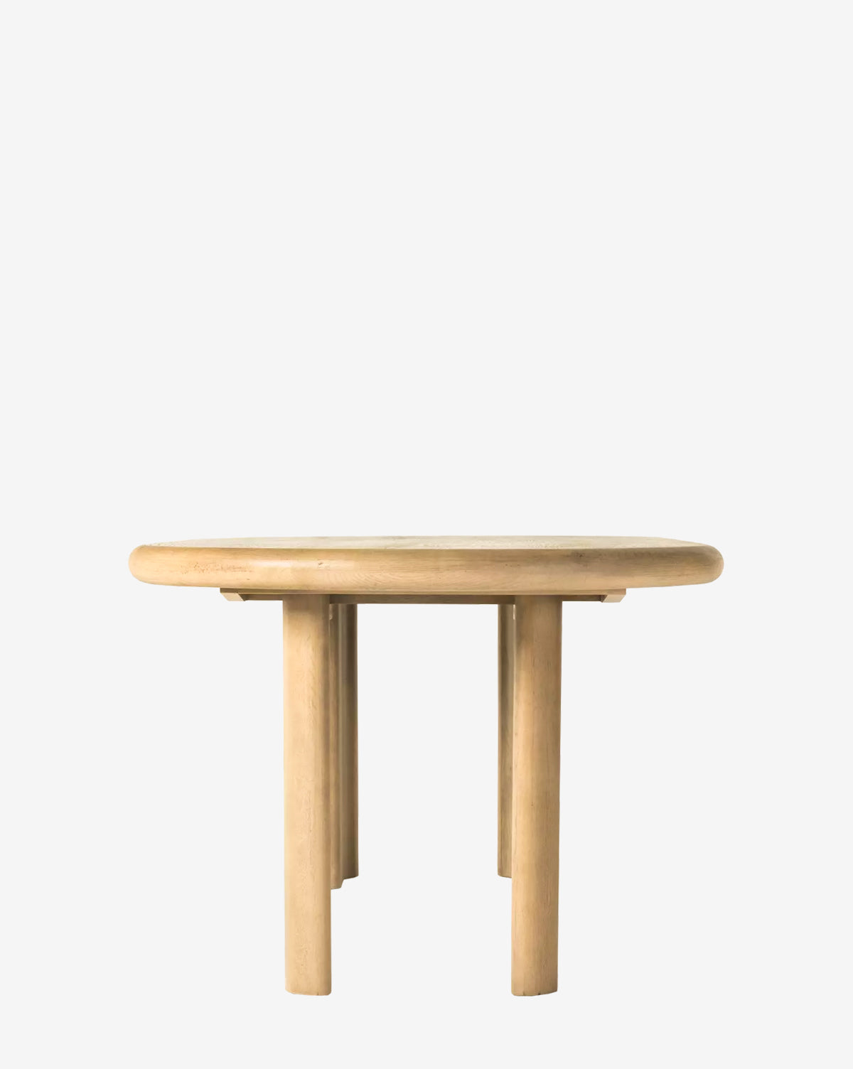The Juliana Extension Dining Table is a round solid oak table with a smooth, light finish and four thick cylindrical legs, showcasing modern design against a plain white background by McGee & Co.