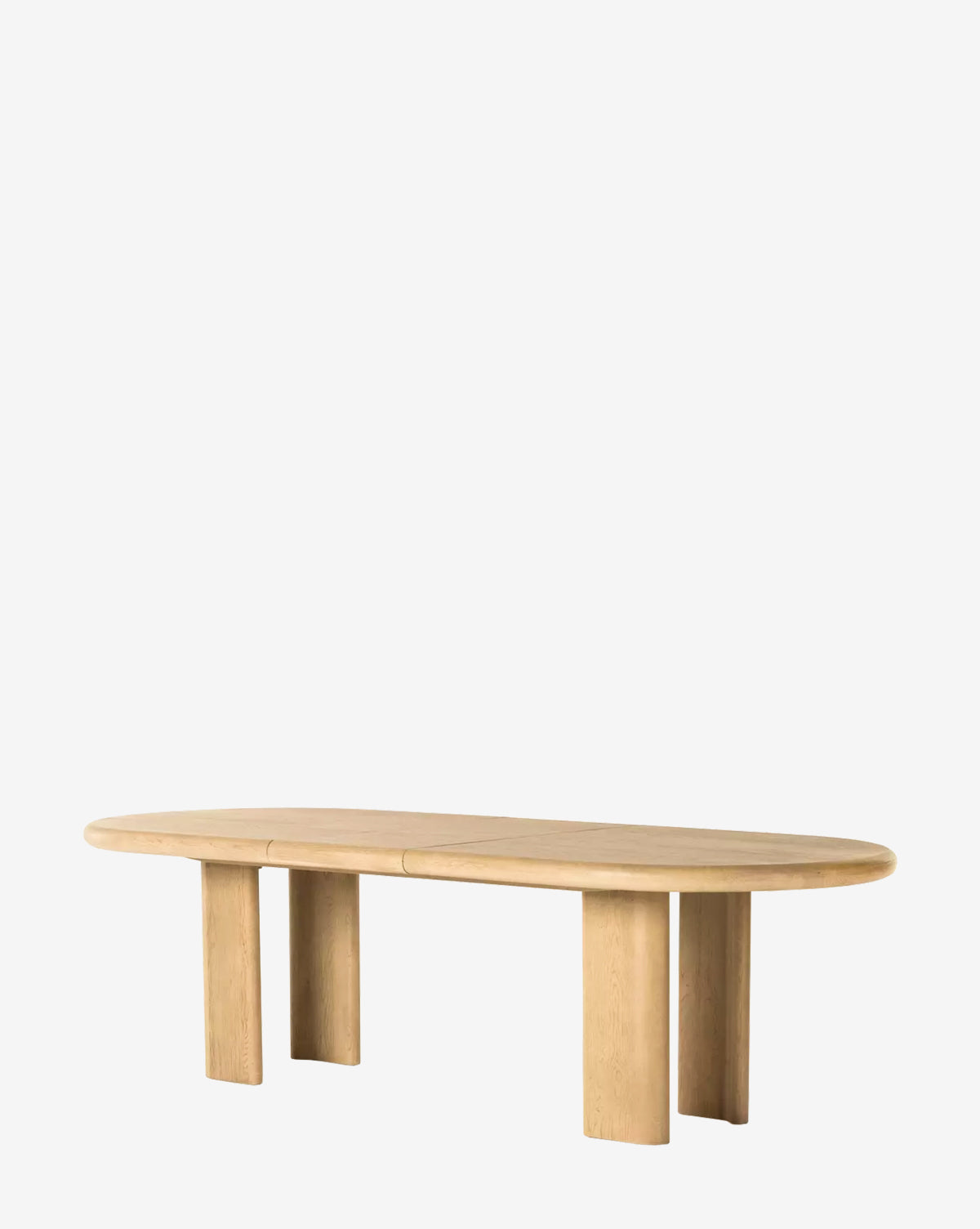 The Juliana Extension Dining Table is a large, solid oak piece with an oval top and four wide, rectangular legs. Featuring smooth edges and a natural finish, its minimalist modern design is set against a plain white background by McGee & Co.