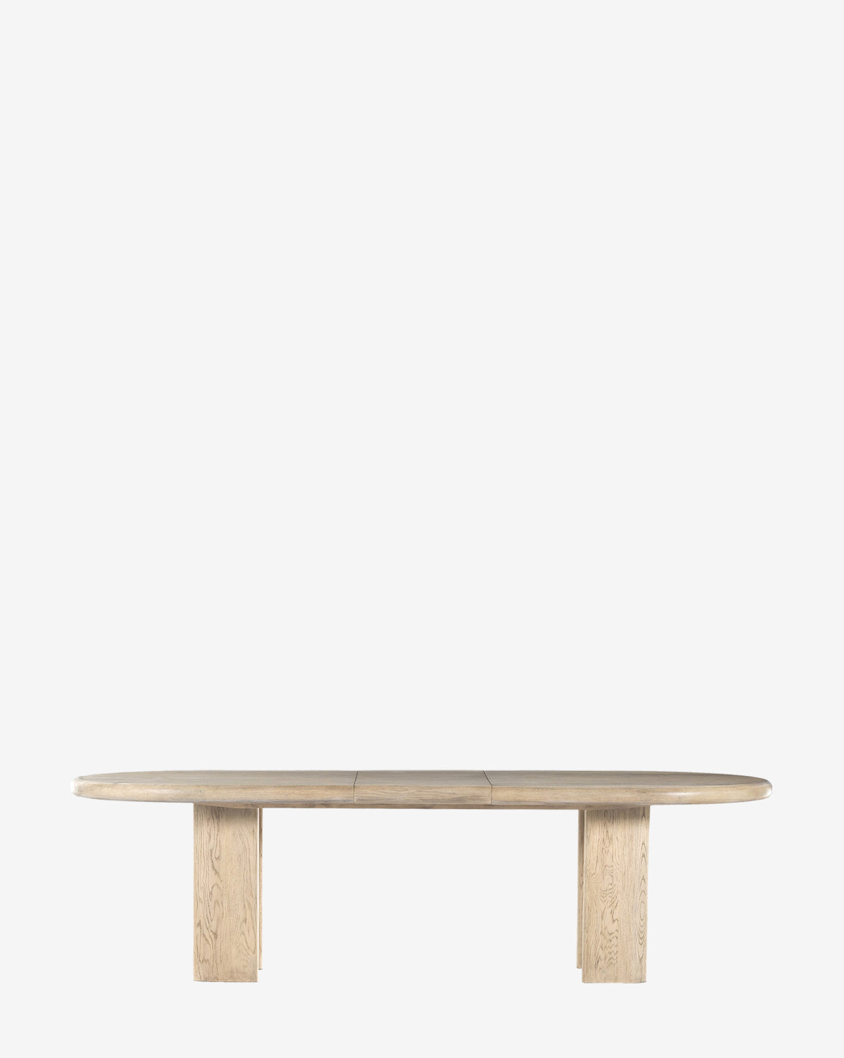 The Juliana Extension Dining Table features a modern, solid oak design with a smooth oval top and two rectangular pedestal legs, highlighting contemporary elegance against a plain white background, by McGee & Co.