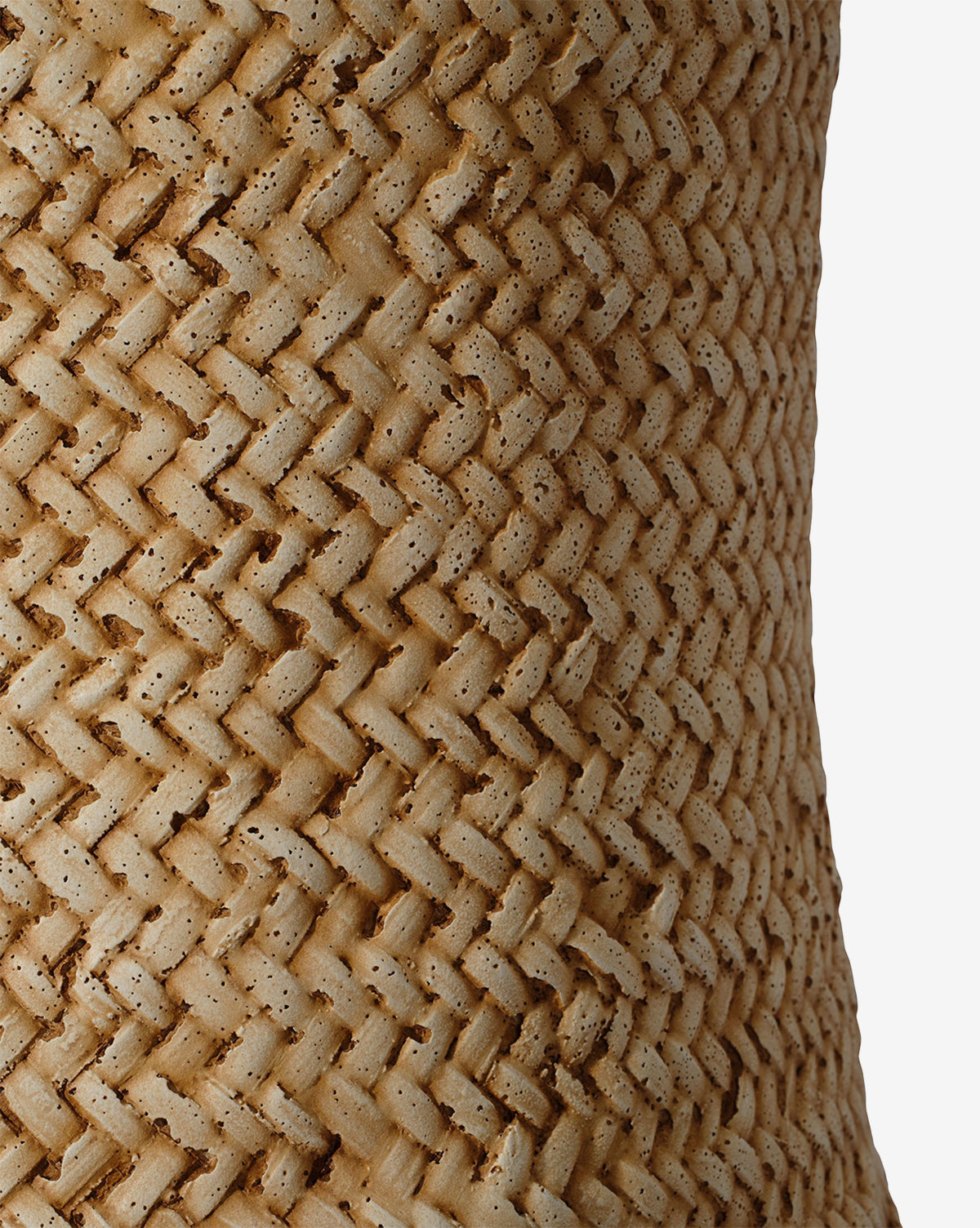 Close-up of the Keira Stool by Made Goods, featuring a woven, textured surface crafted from natural light brown fibers in a diagonal zigzag pattern, showcased against a plain white background. McGee & Co.