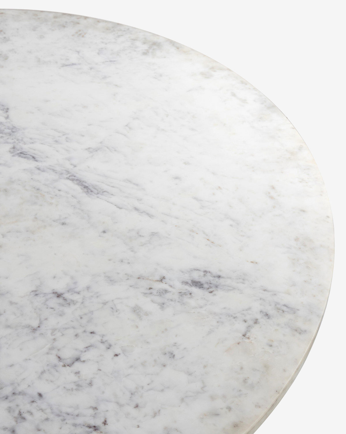 A close-up view of the Kinlaw 60 Round Dining Table’s white marble top with subtle gray veining, set against a plain white background, perfectly highlights its sophisticated elegance, by McGee & Co.