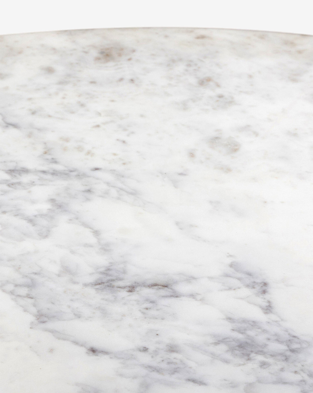 Close-up of the Kinlaw 60 Round Dining Table, showcasing its smooth white marble tabletop with gray veining and subtle brownish spots, by McGee & Co.