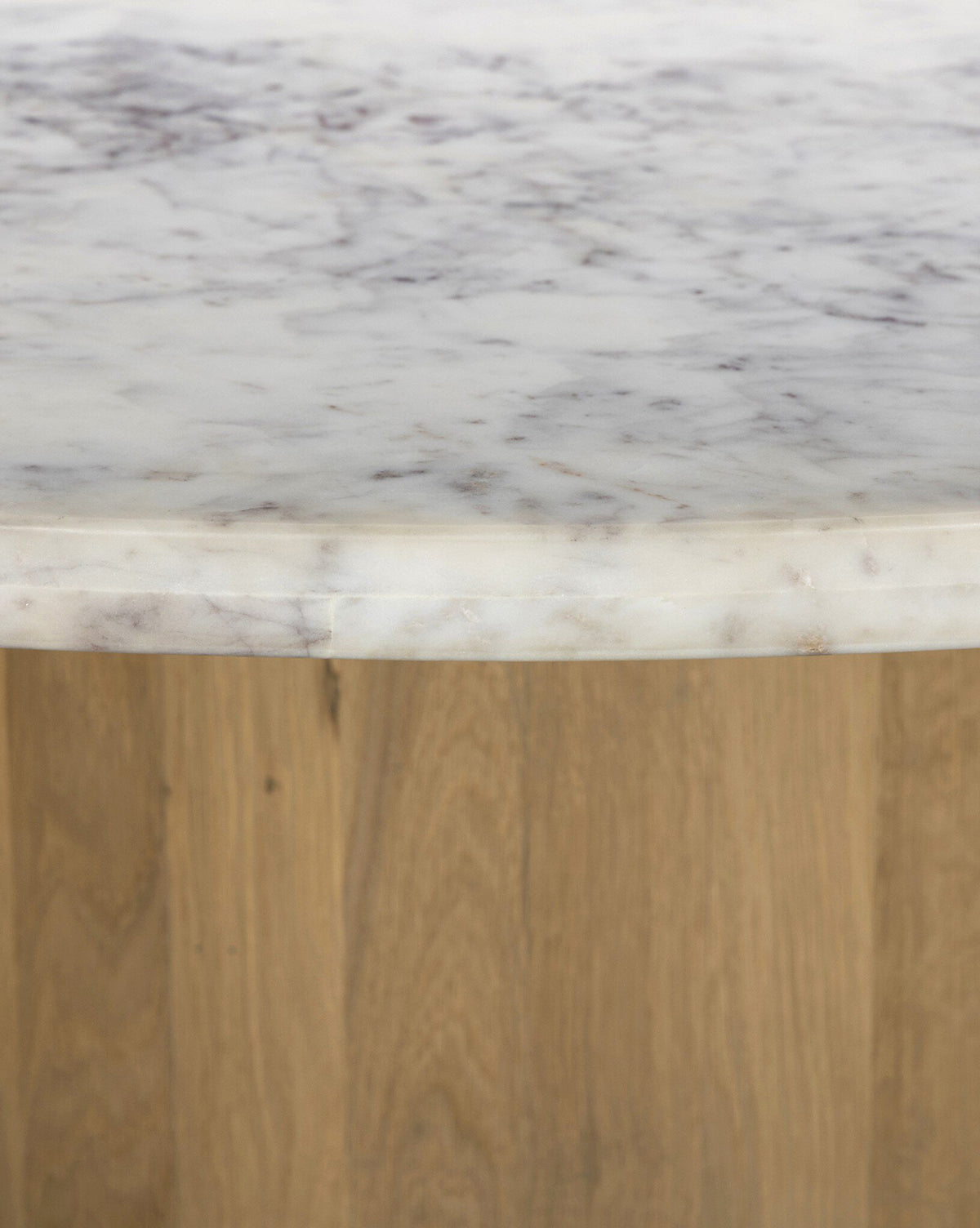 The Kinlaw 60 Round Dining Table features a white marble tabletop with gray veining and a light solid oak base, by McGee & Co.