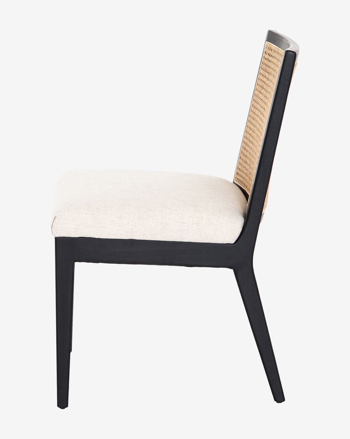 The Landon Dining Chair has a black wood frame, light beige performance fabric seat, and a woven rattan cane backrest, presented in profile, by McGee & Co.