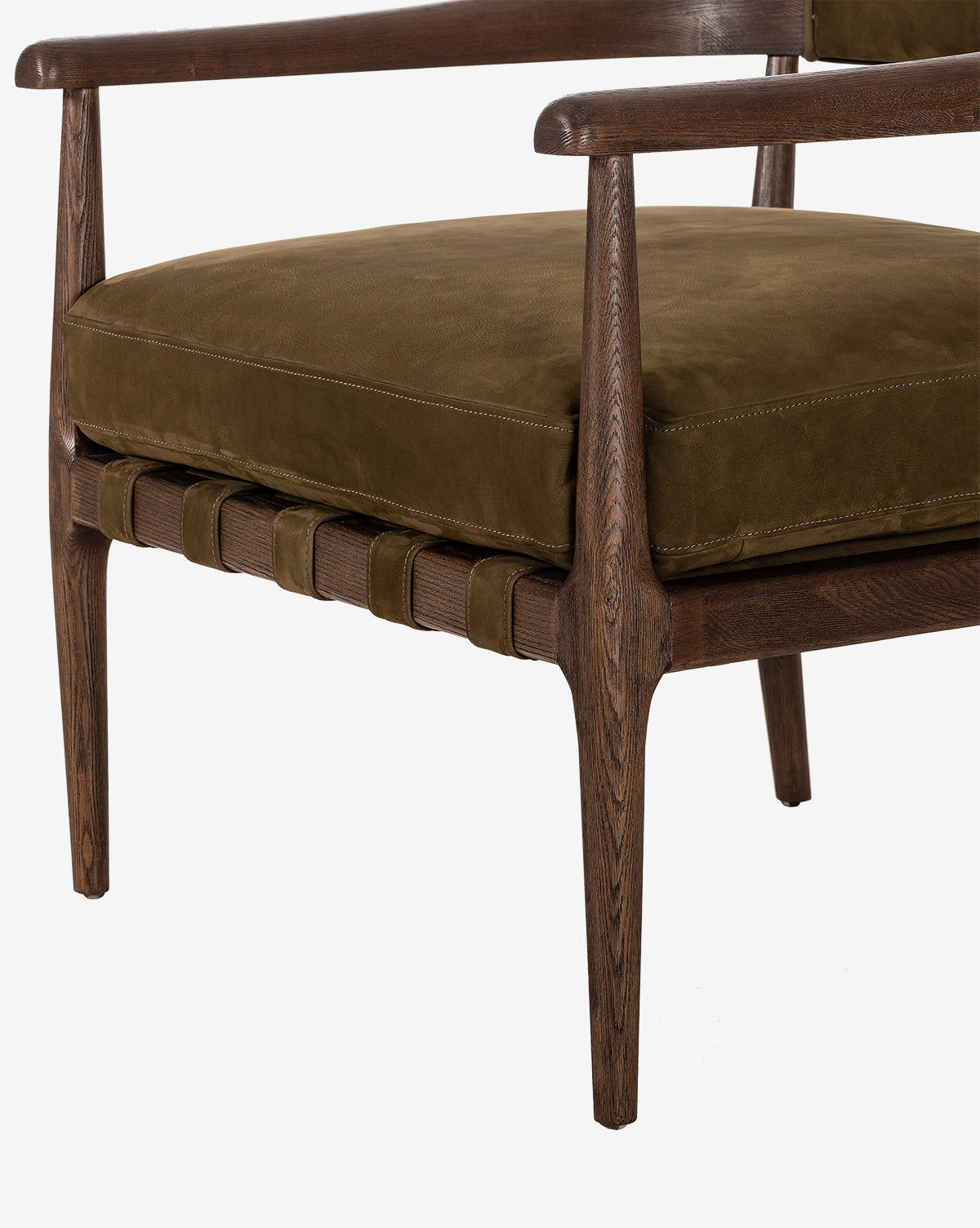 A close-up of the Larisa Lounge Chair, featuring a solid ash frame, olive green velvet seat cushion, sleek armrests, and woven support straps visible beneath the cushion, by McGee & Co.