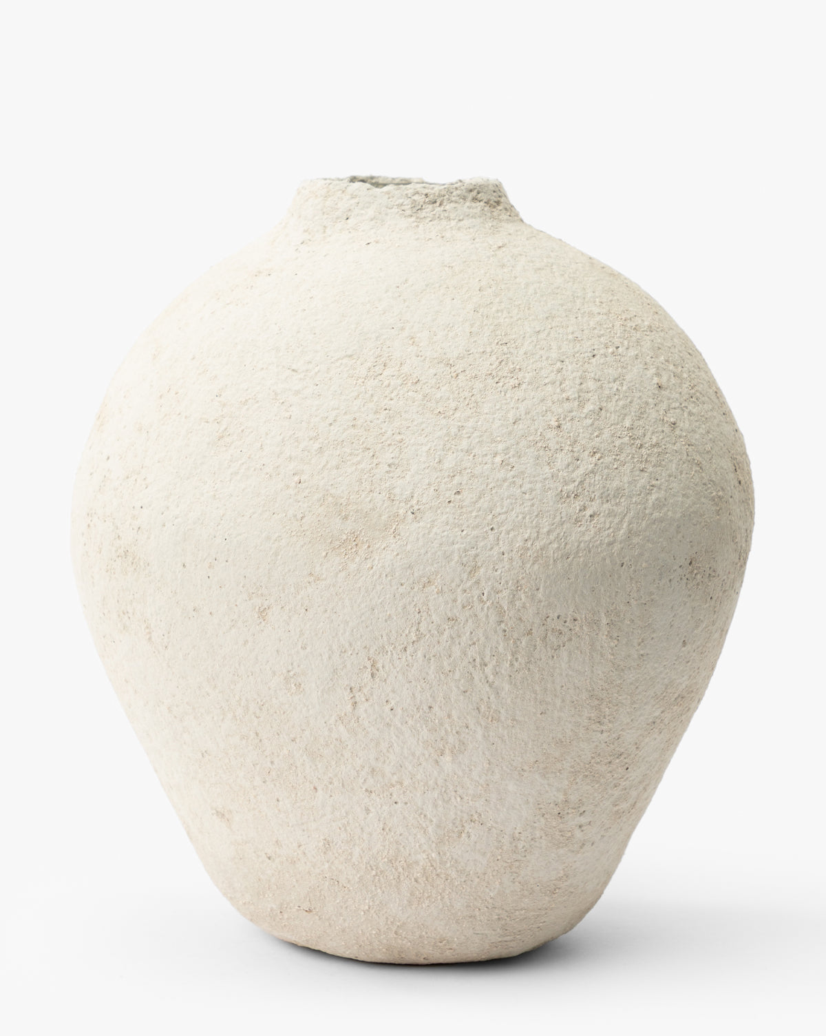 The LeBeau Paper Mache Vase is a white, textured, round artisanal piece with a narrow, slightly uneven opening, shown against a plain white background by McGee & Co.