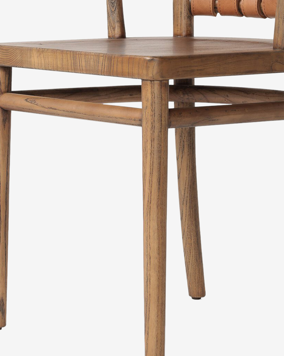A close-up of the Lennon Dining Chair, featuring a smooth wooden seat, square legs, and a partial view of the backrest, isolated on a white background, by McGee & Co.