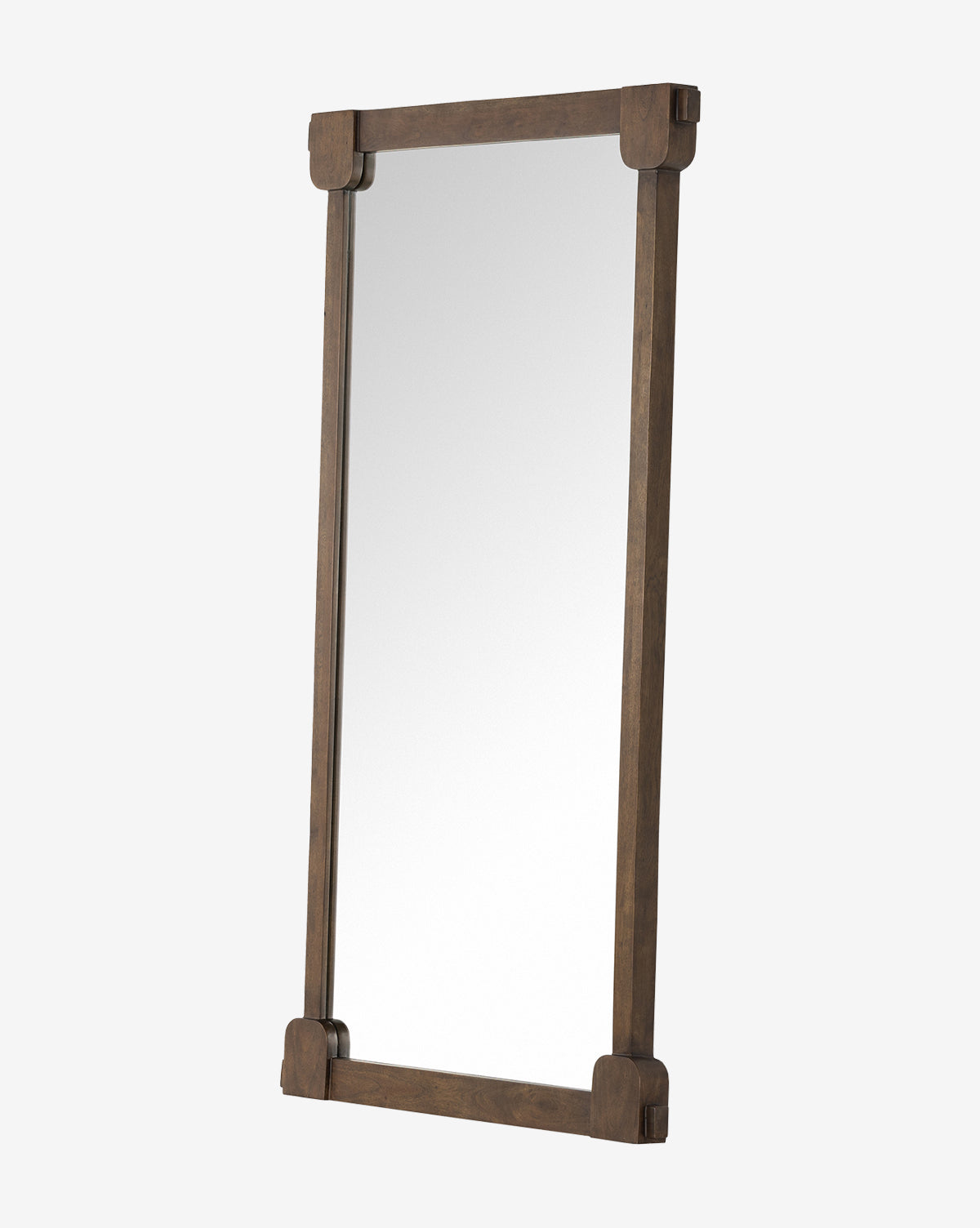 The Letterly Floor Mirror showcases traditional craftsmanship with its solid acacia wood frame and rounded corner brackets, displayed at an angle against a plain white background, by McGee & Co.