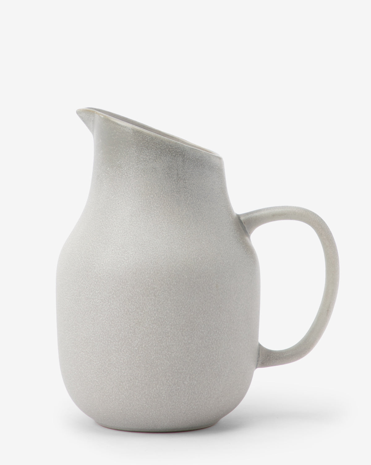 The Levi Stoneware Pitcher features a light gray rounded body, wide spout, and curved handle, shown against a plain white background by McGee & Co.