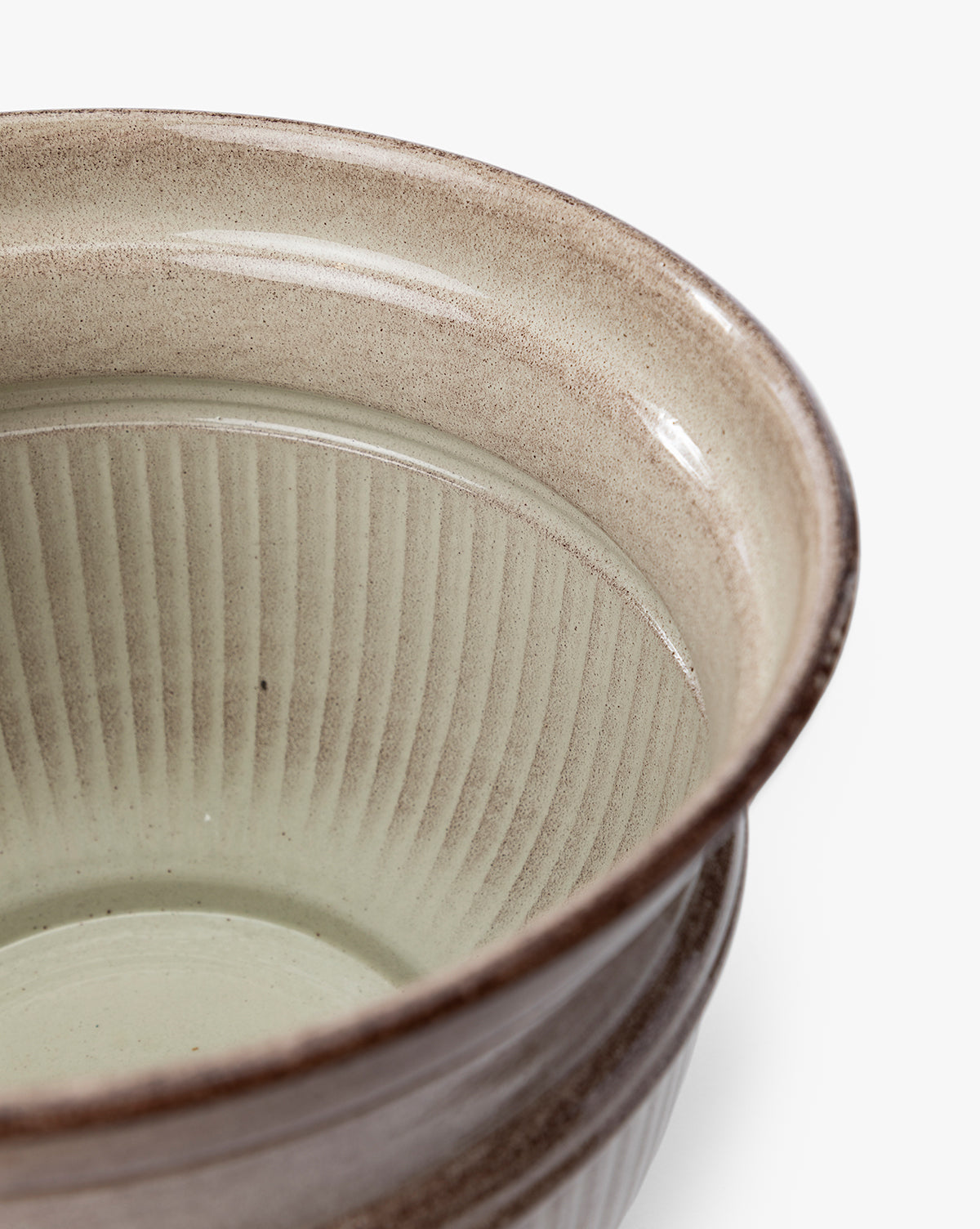 Close-up of the Lichfield Planters (Set of 3), featuring a textured, ribbed interior and smooth, earthy brown-glazed exterior—ideal as weather-resistant, sophisticated outdoor planters for any setting, by McGee & Co.