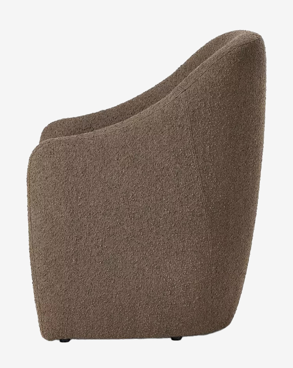 Side view of the Lilou Dining Chair, a modern armchair with a rounded back and smooth, curved lines, upholstered in brown performance fabric—ideal for elevating any dining space, by McGee & Co.