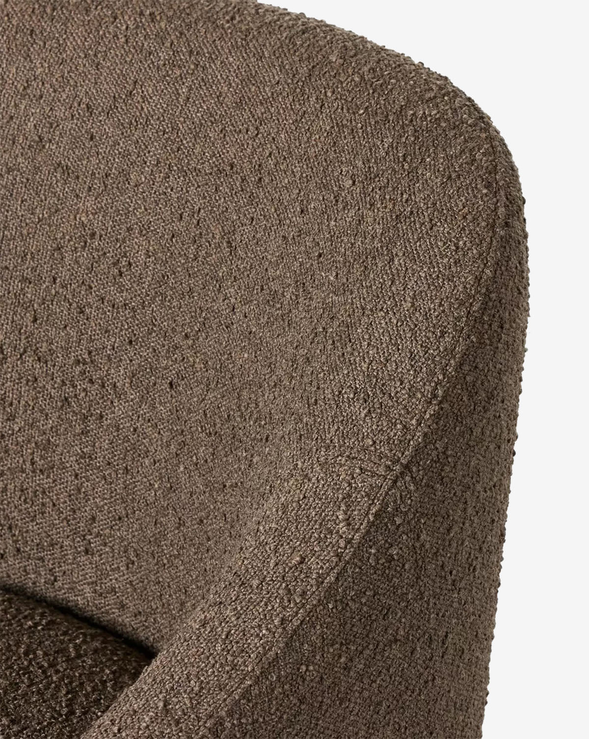 Close-up of the Lilou Dining Chair in brown performance fabric, featuring a curved backrest and arm with detailed weave and soft, padded structure—perfect for elevating your dining room, by McGee & Co.