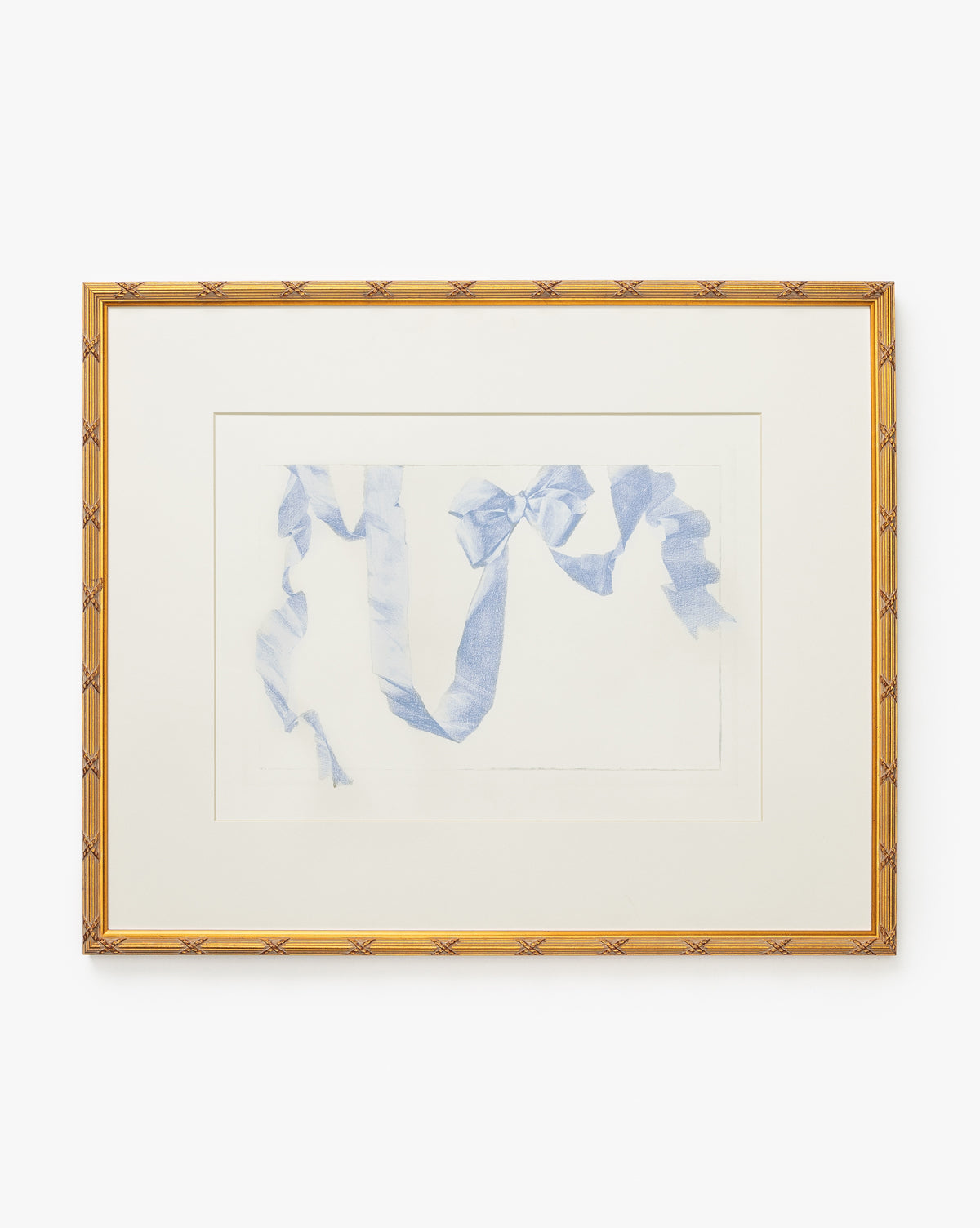 Loose Ribbons is a framed giclee print featuring a delicate light blue ribbon on white, accented with a wide cream mat and gold wood frame—perfect for brightening up any children’s room, by McGee & Co.