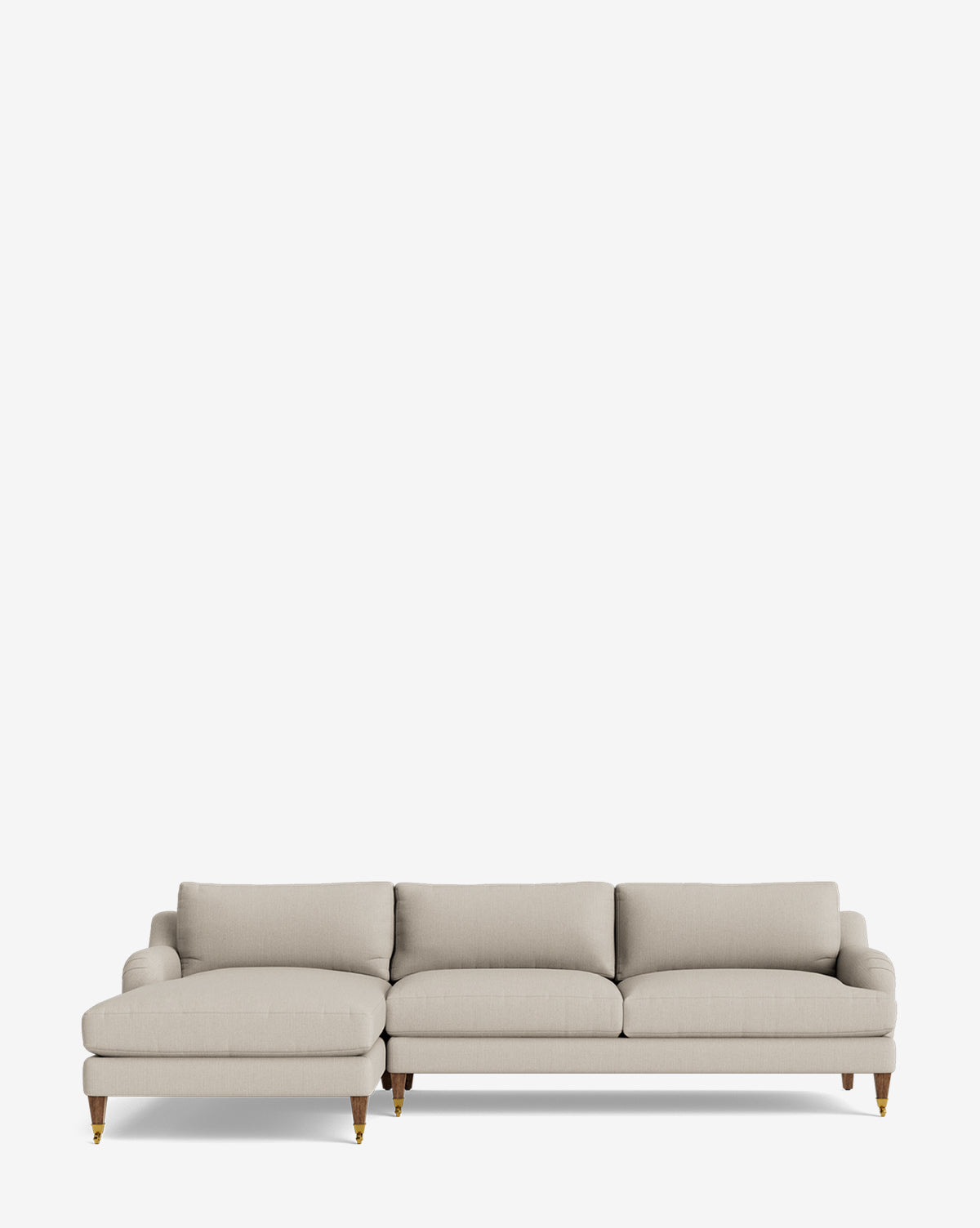 The Lucille English Roll Arm Left Chaise Sectional 107 is a modern light beige sofa with three seat and back cushions, English roll arms, and wooden legs with brass casters, shown on a plain white background by McGee & Co.