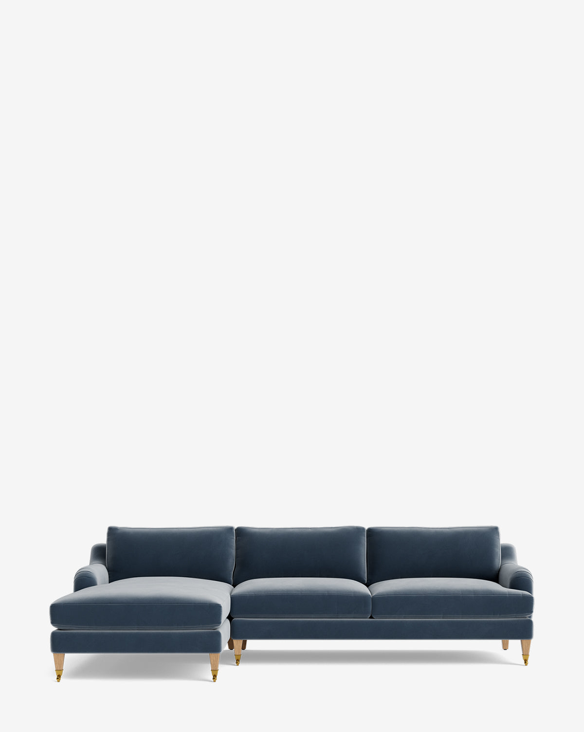 The Lucille English Roll Arm Left Chaise Sectional 107 features deep blue upholstery, three seat and back cushions, and gold-capped wooden legs. It is showcased against a plain white background for a modern look, by McGee & Co.