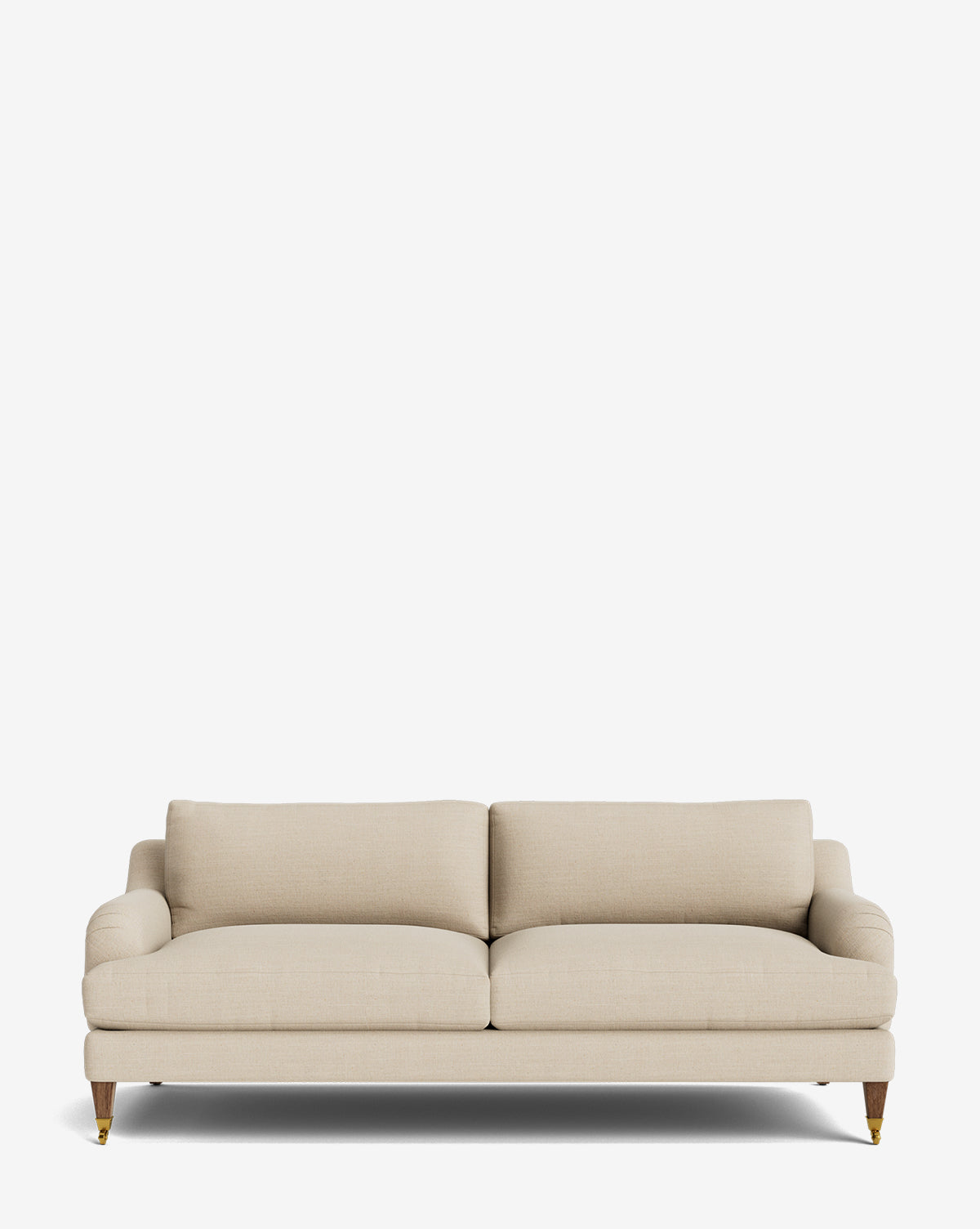 The Lucille English Roll Arm Sofa 78 features plush, down-wrapped cushions, beige upholstery, wooden legs, and brass castor wheels, shown against a plain white background by McGee & Co.
