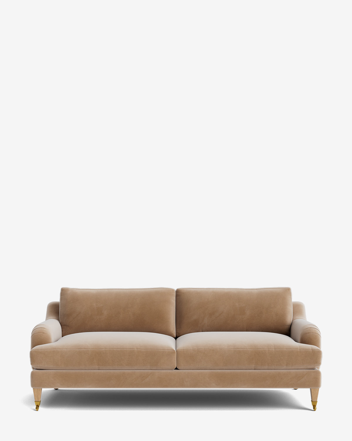 The Lucille English Roll Arm Sofa 78 features beige velvet upholstery, two down-wrapped seat cushions, two back cushions, rounded arms, and four wooden legs with brass casters, displayed on a plain white background by McGee & Co.