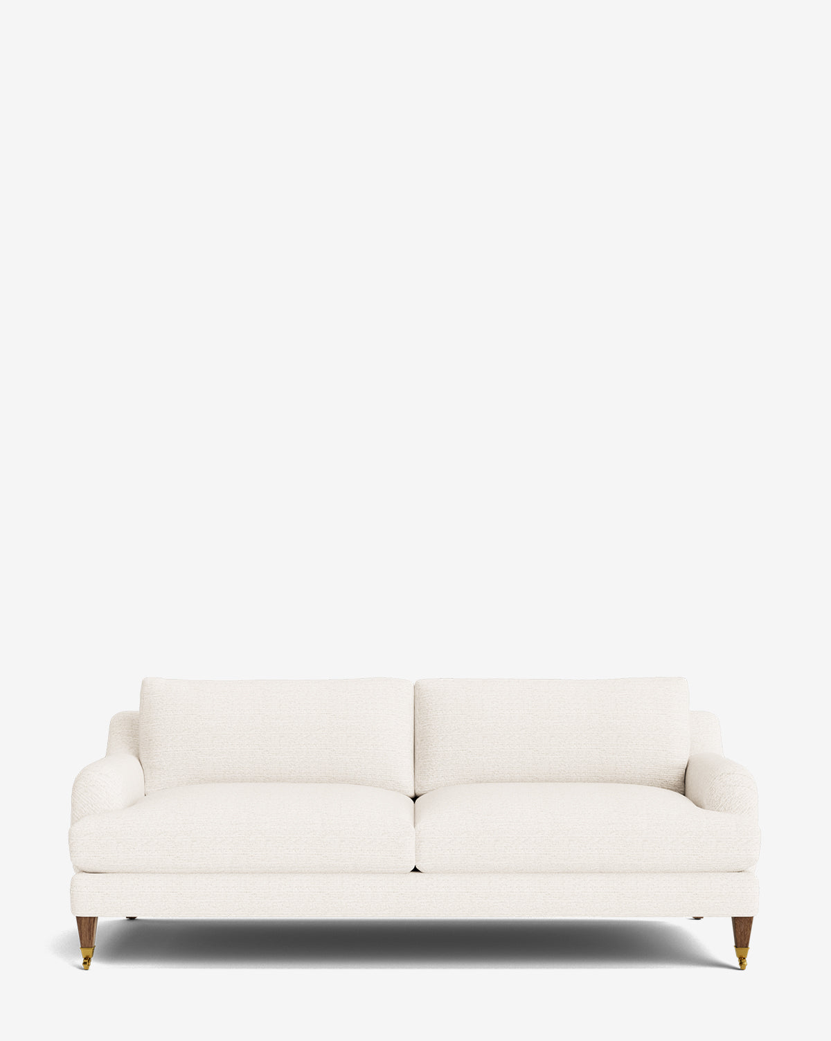 The Lucille English Roll Arm Sofa 78 features down-wrapped cushions, two seat and back cushions, rounded armrests, and four wooden legs with brass castors, shown against a plain white background by McGee & Co.