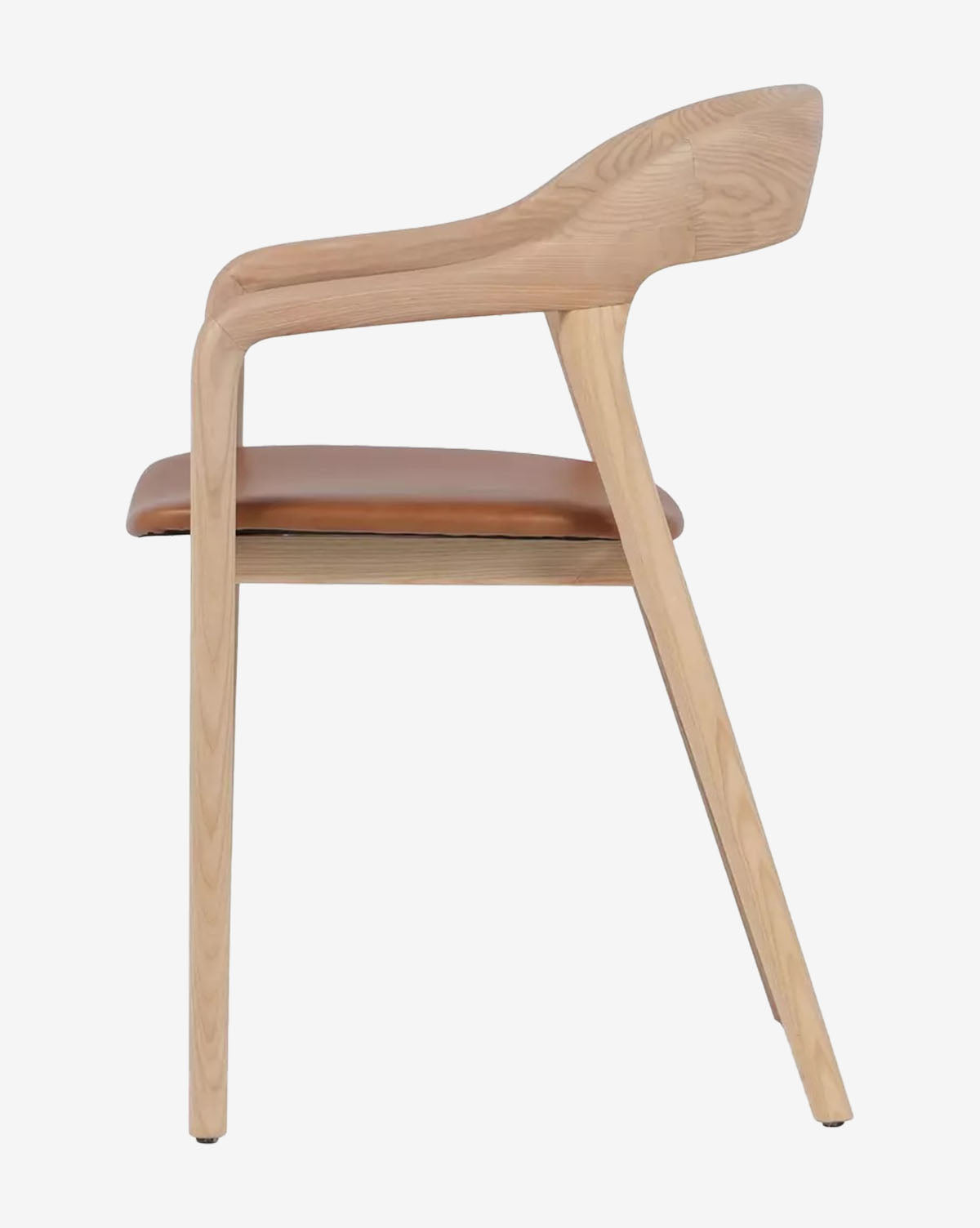 Side view of the Lucinda Dining Armchair: Scandinavian design with curved armrests, brown top grain leather cushioned seat, and natural wood frame. Clean, minimalist lines showcase its sleek appeal, by McGee & Co.