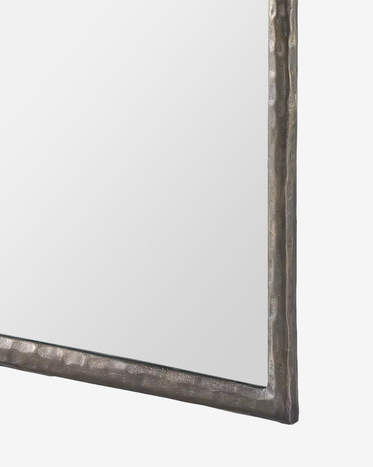 A close-up of the Lumi Wall Mirrors corner, showcasing its textured metallic frame against a white background, by McGee & Co.