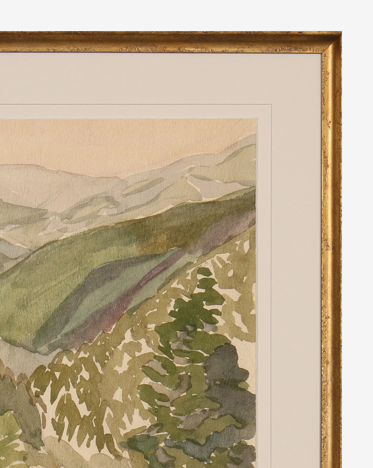 A close-up of the Lush Hillside museum-quality giclee print, featuring green hills and trees in soft, muted tones, displayed with a gold-finished wood frame and white mat.