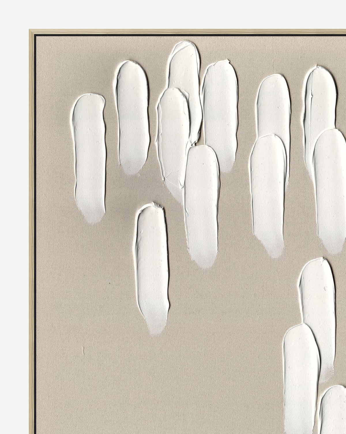 Neutral Cascade I features textured white paint strokes in elongated vertical ovals, clustered on a beige canvas. Framed in a thin black border, this minimalist abstract wall art is perfect for fans of neutral palette decor.