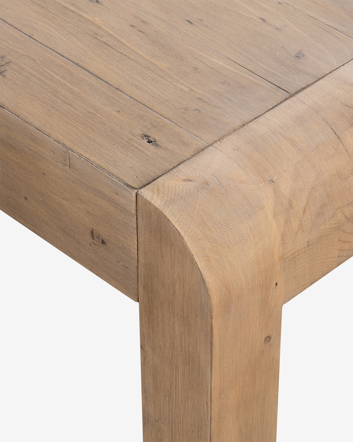 Close-up of the Elisha Extension Dining Table in reclaimed wood with a natural finish, showcasing its rich grain and texture. Thick, sturdy legs with gently rounded edges highlight the table’s rustic charm, by McGee & Co.