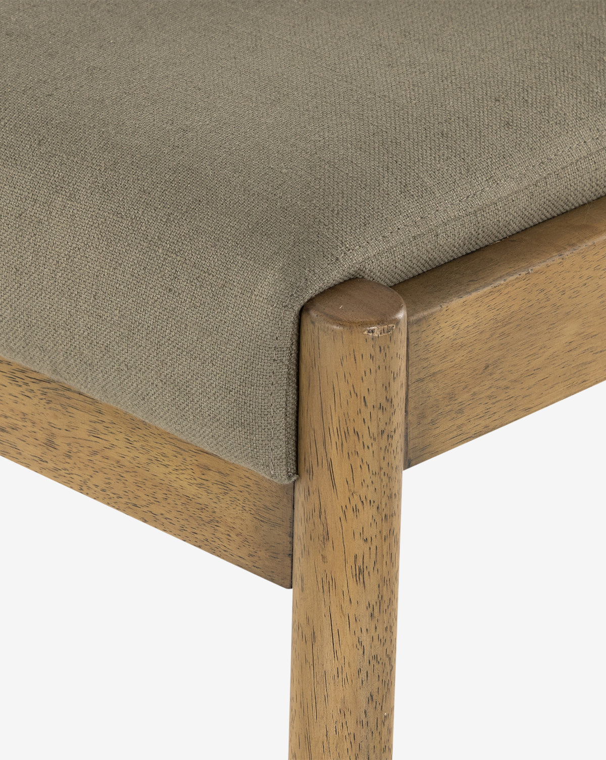 Close-up of the Bardot Dining Chairs natural parawood frame and beige upholstered seat, showing off the durable, textured high-performance fabric and wood grain, by McGee & Co.