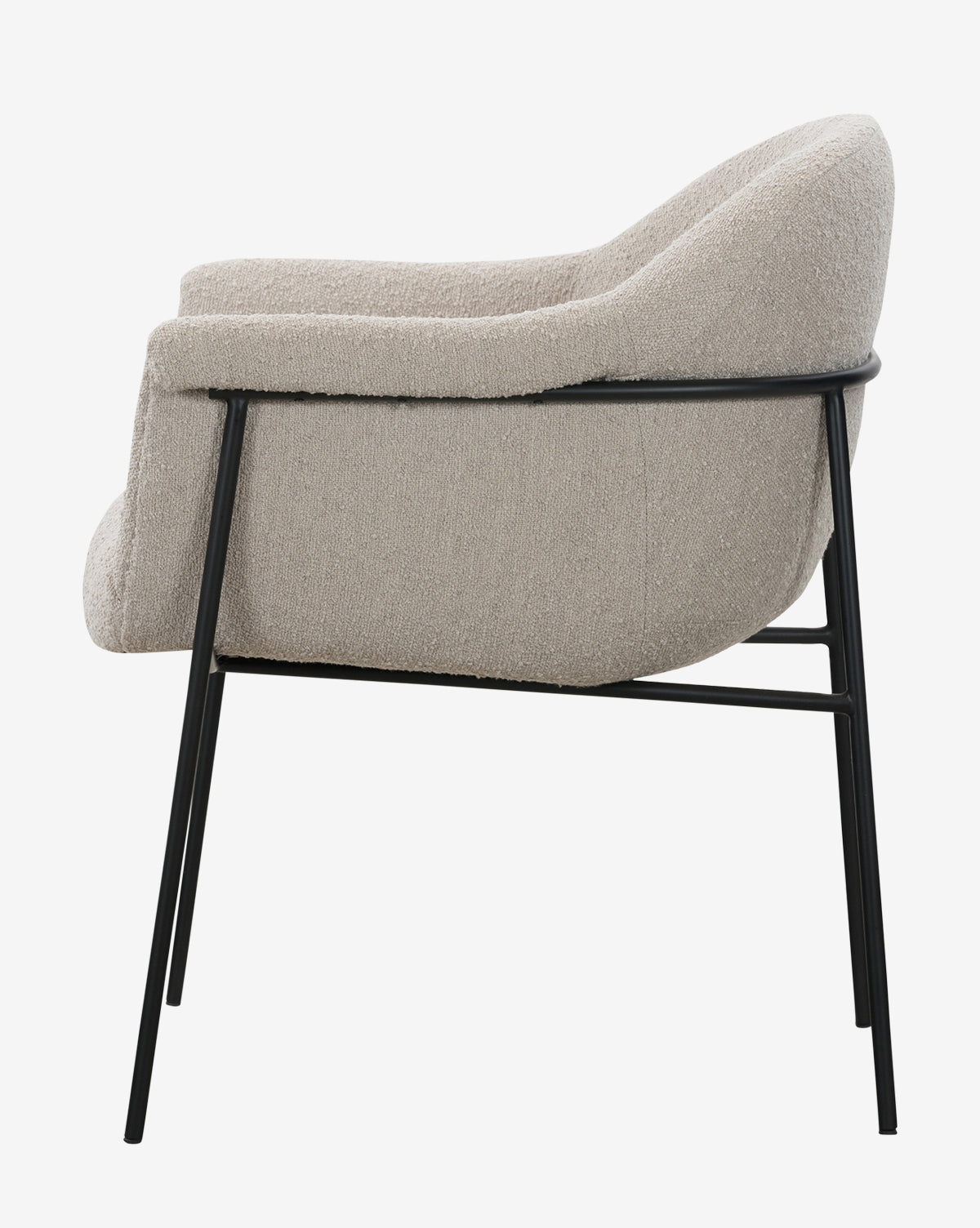 Side view of the Sabbath Dining Chair featuring light beige performance fabric and a black metal frame, evoking a vintage dining chair style, isolated on a white background, by McGee & Co.