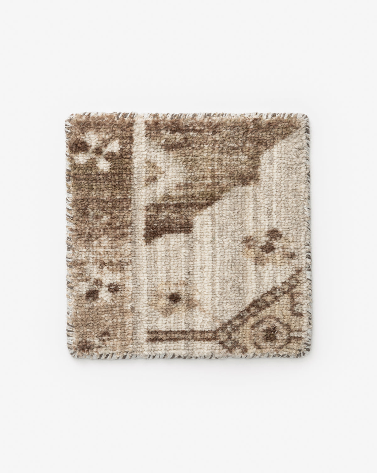 The Conway Handwoven Wool Rug Swatch features a textured square design in beige and brown, blending geometric and floral patterns inspired by botanical motifs, displayed against a white background, by McGee & Co.