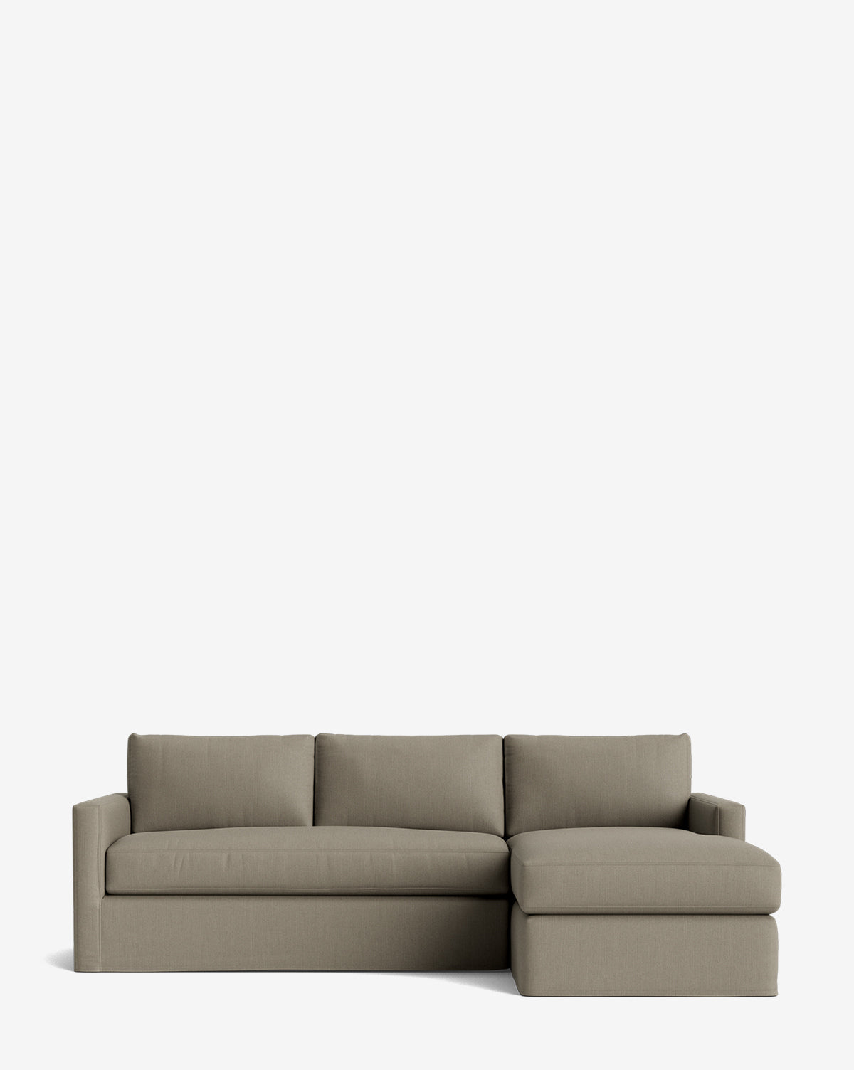 The Macy Slipcover Chaise Sectional 101 is a modern, light gray sectional with clean lines, three seat cushions, and a right-facing chaise lounge. Customizable and minimalist, its shown against a plain white background by McGee & Co.