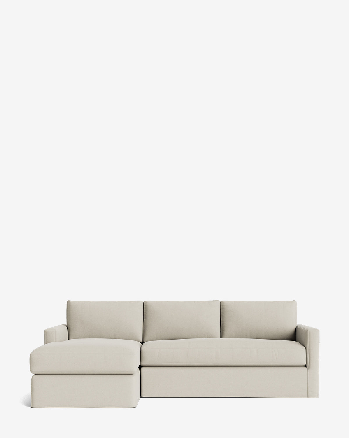 The Macy Slipcover Chaise Sectional 101 in light beige features three seat cushions and a left-facing chaise lounge, shown against a plain white background, by McGee & Co.
