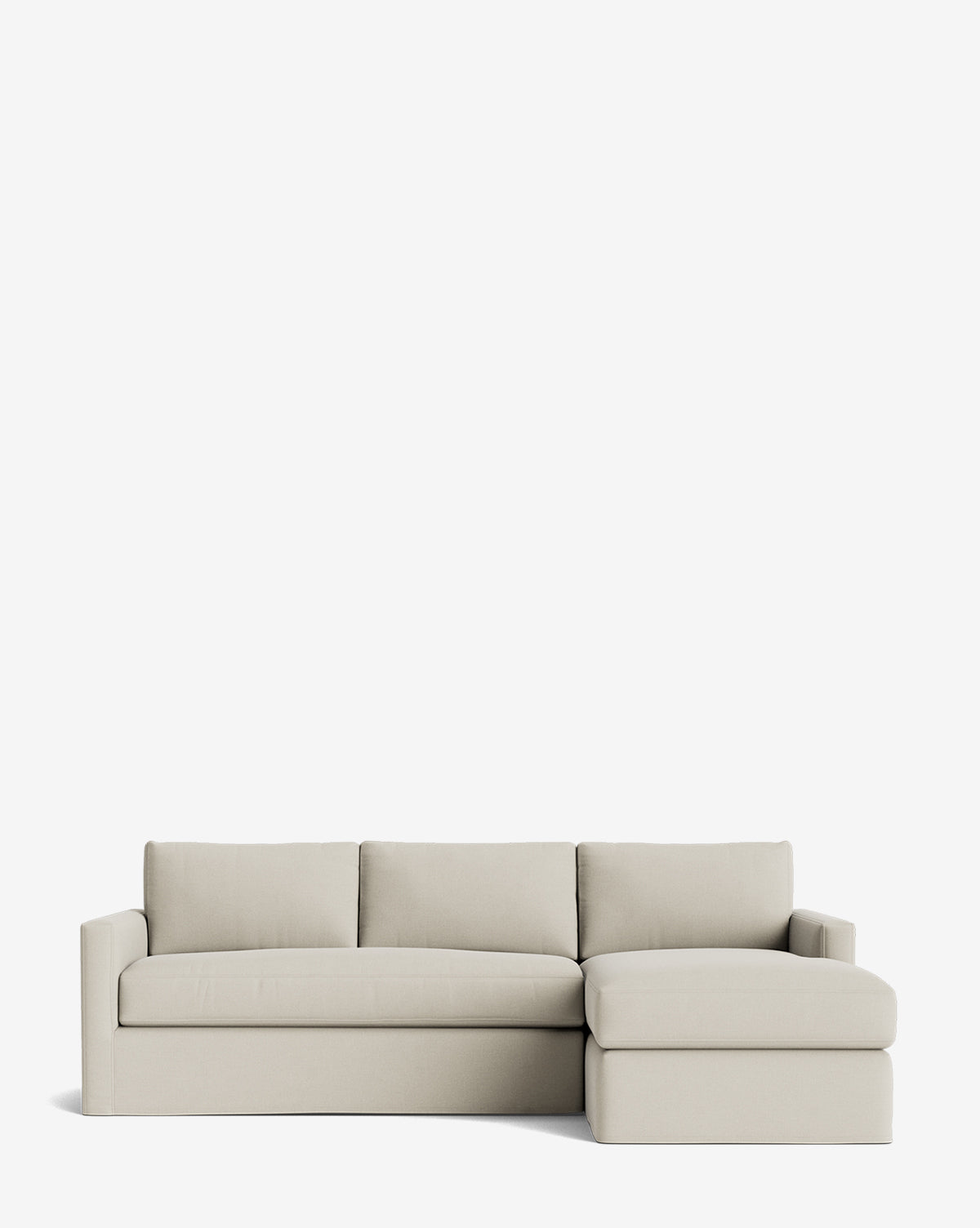 The Macy Slipcover Chaise Sectional 101 is a modern, light beige sectional with a right-side chaise lounge, clean lines, three back cushions, and low square arms, shown against a plain white background by McGee & Co.