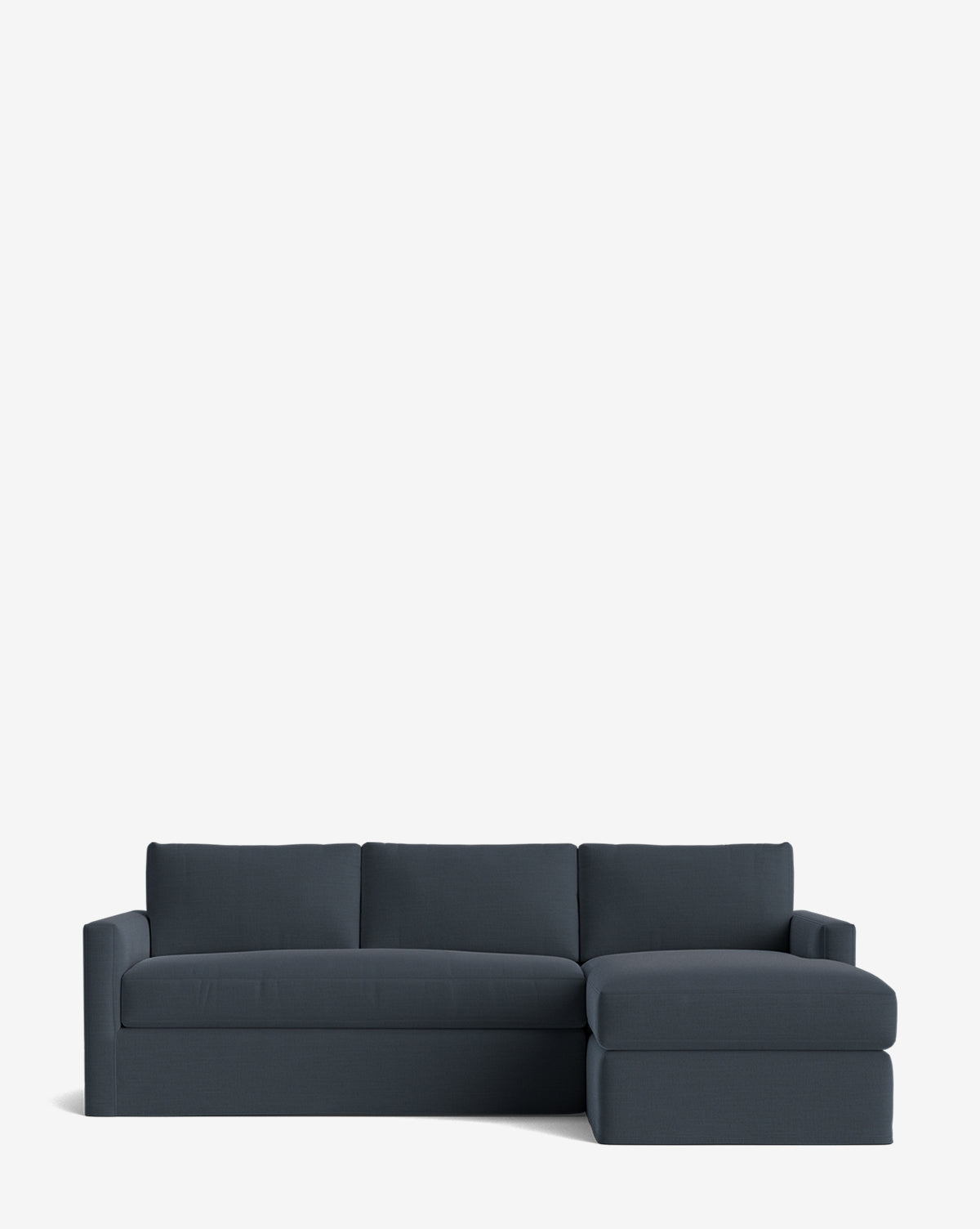 The Macy Slipcover Chaise Sectional 101 is a modern deep sectional in dark blue with three seat cushions, three back cushions, and a right-facing chaise, displayed against a plain white background by McGee & Co.