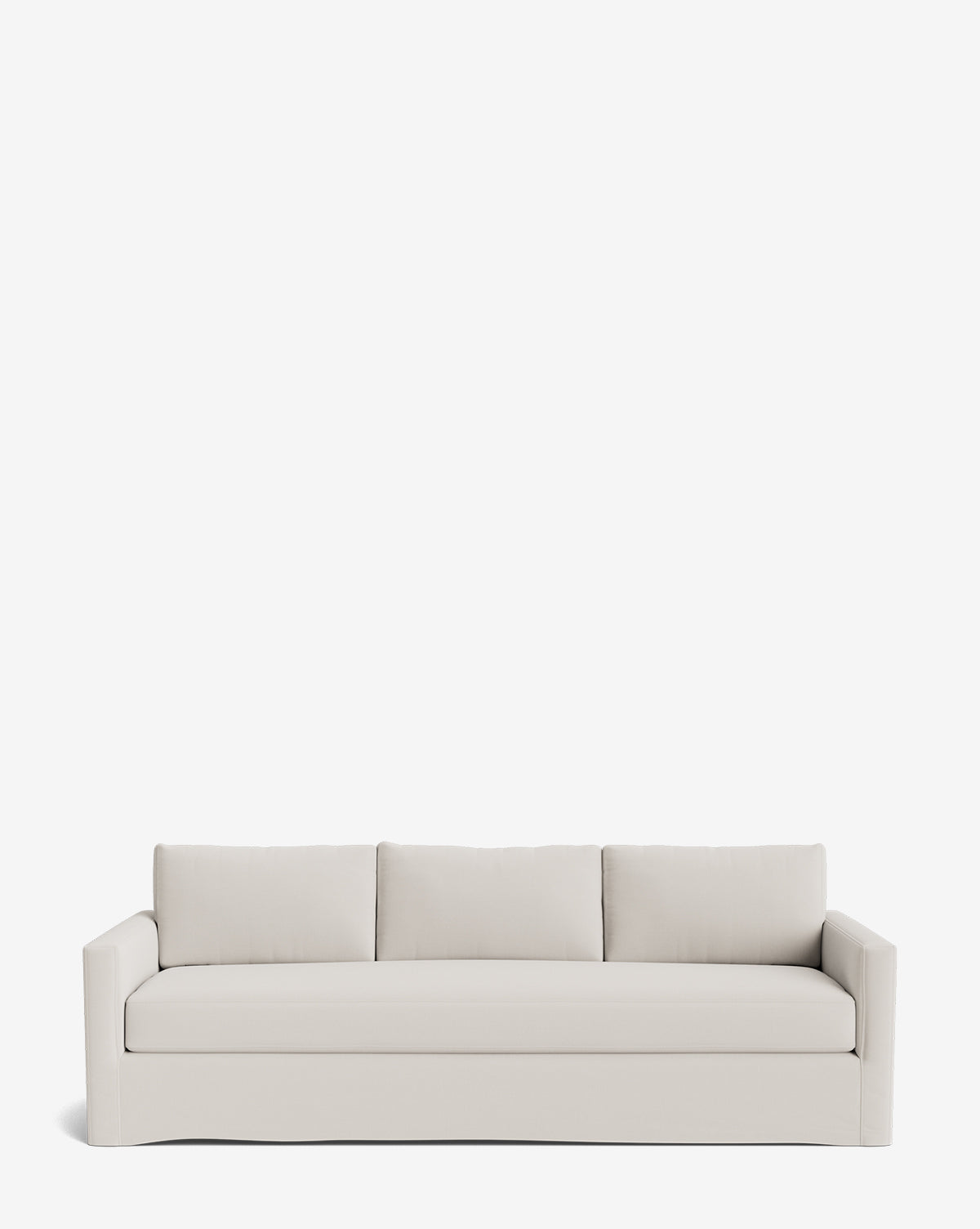 The Macy Slipcover Sofa (84-96) is a modern, light beige deep sofa with three back cushions and low, straight arms, shown against a plain white background by McGee & Co.