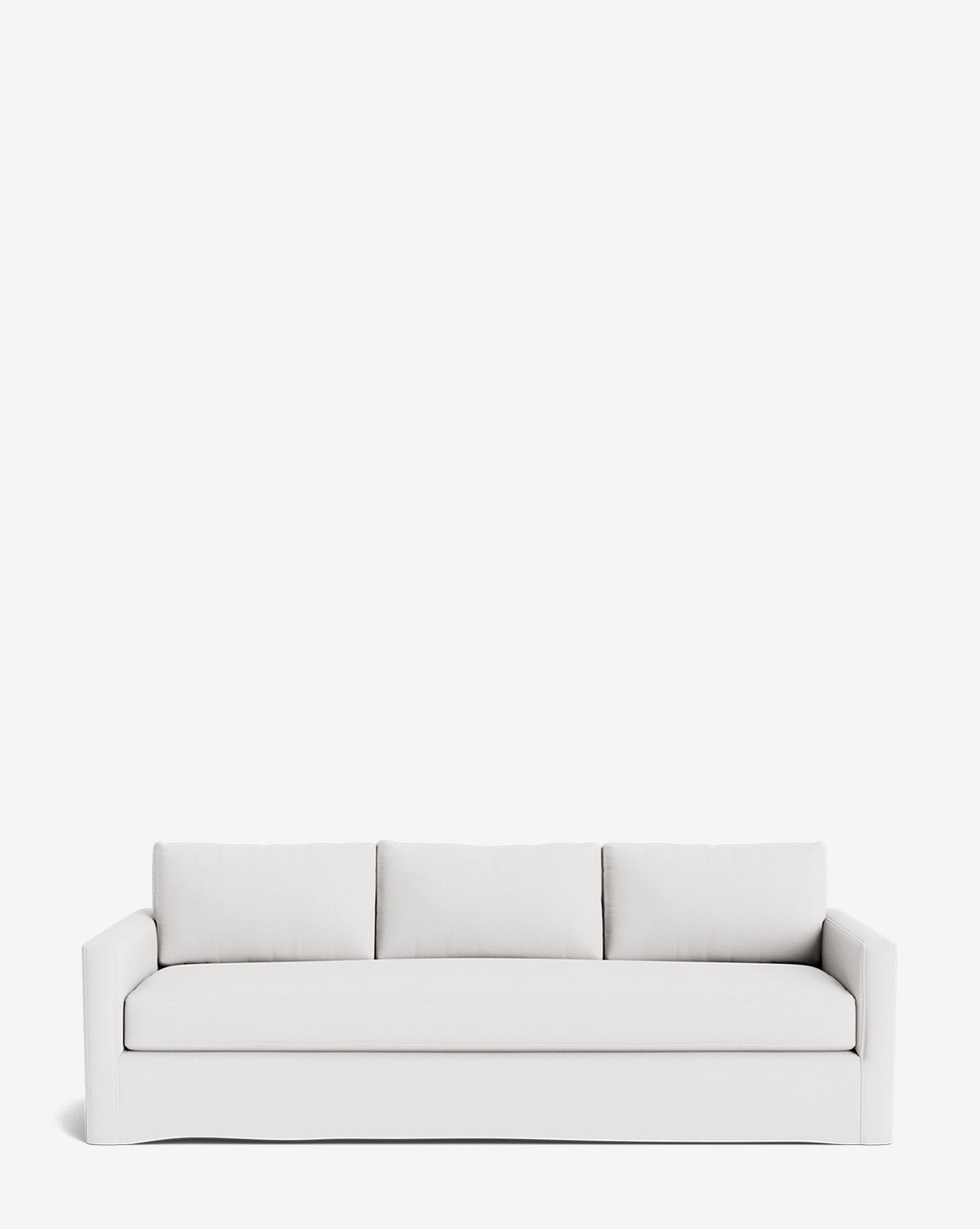 The Macy Slipcover Sofa (84-96) is a modern, white customizable sofa with clean lines, low arms, and three back cushions, combining flexibility and style. Shown here against a plain white background by McGee & Co.