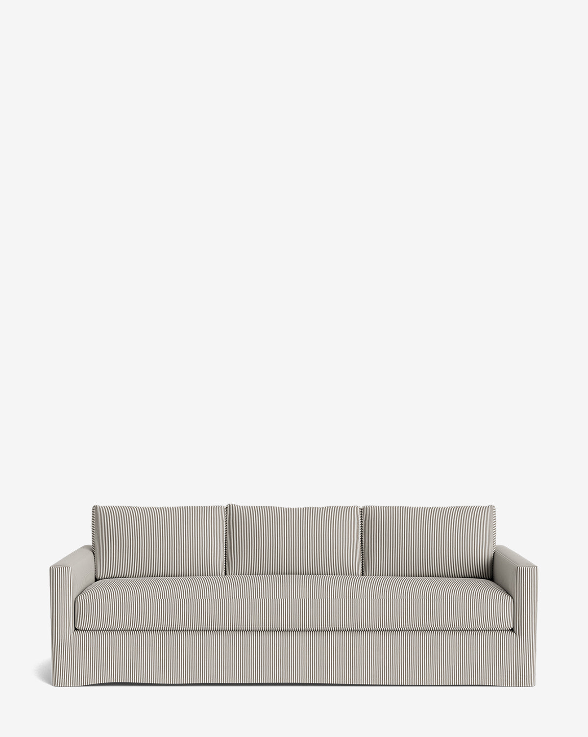 The Macy Slipcover Sofa (84-96) is a modern, light gray customizable sofa with subtle vertical stripes, three seat cushions, and three back cushions, shown against a plain white background by McGee & Co.