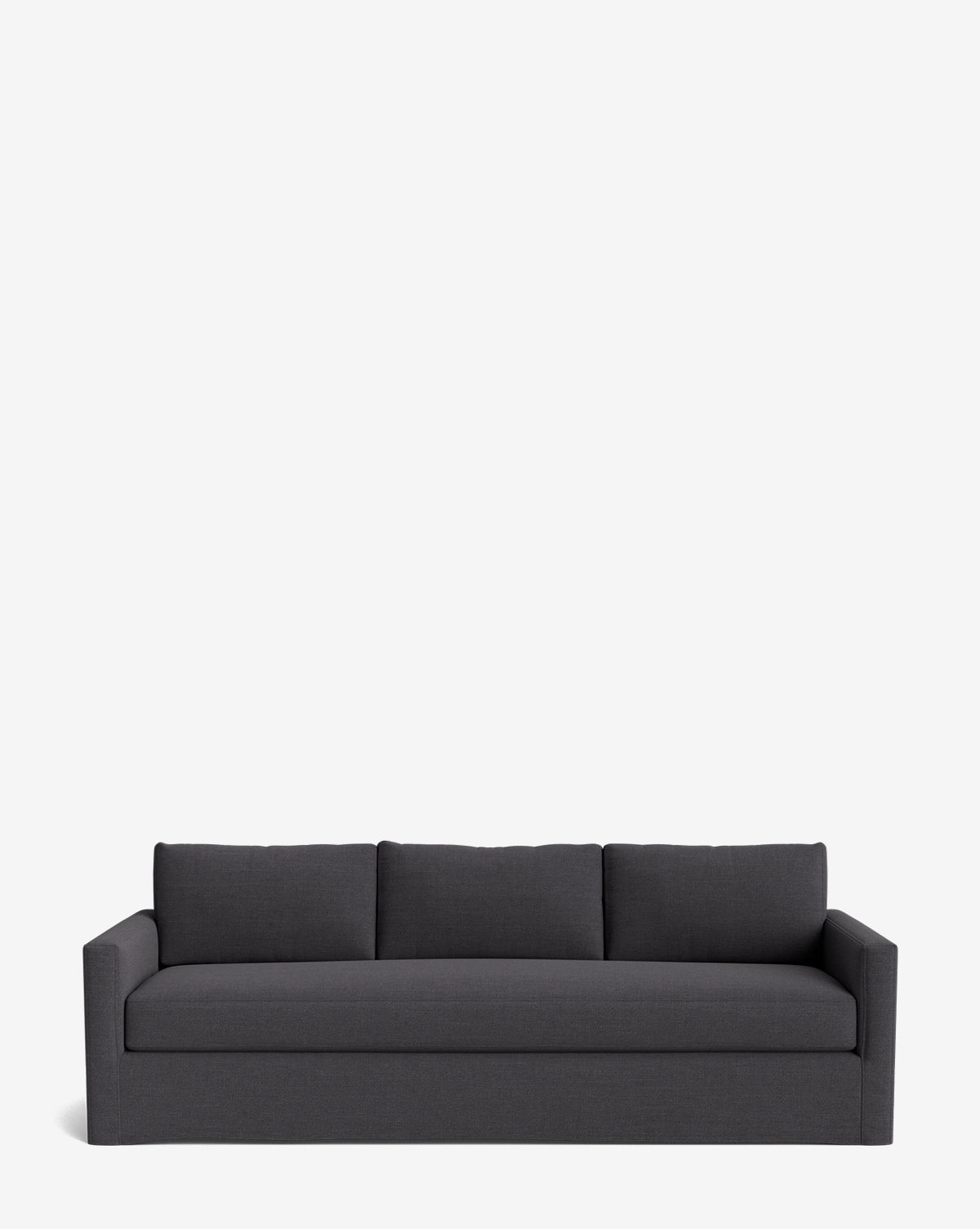 The Macy Slipcover Sofa (84-96) is a modern, dark gray sofa with three seat and back cushions, straight arms, and a minimalist design, shown against a plain white background by McGee & Co.