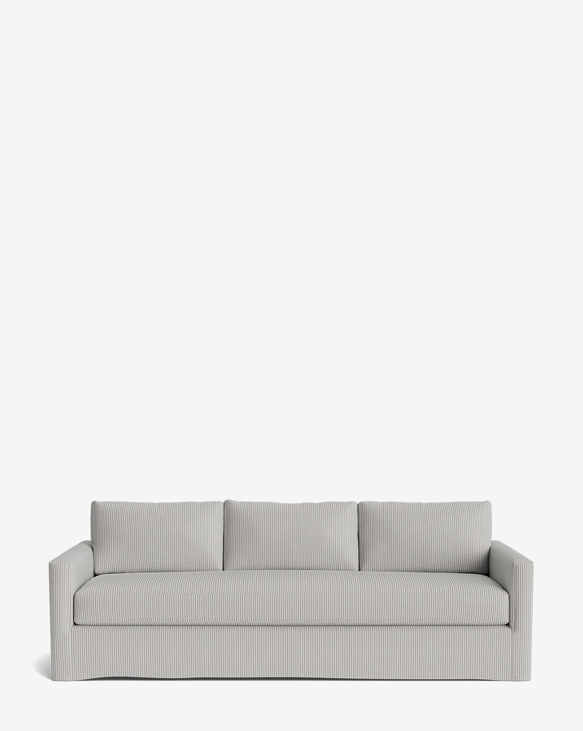 The Macy Slipcover Sofa (84-96) is a modern, light gray three-seater featuring a low backrest, squared arms, and subtle vertical stripes, shown against a plain white background by McGee & Co.