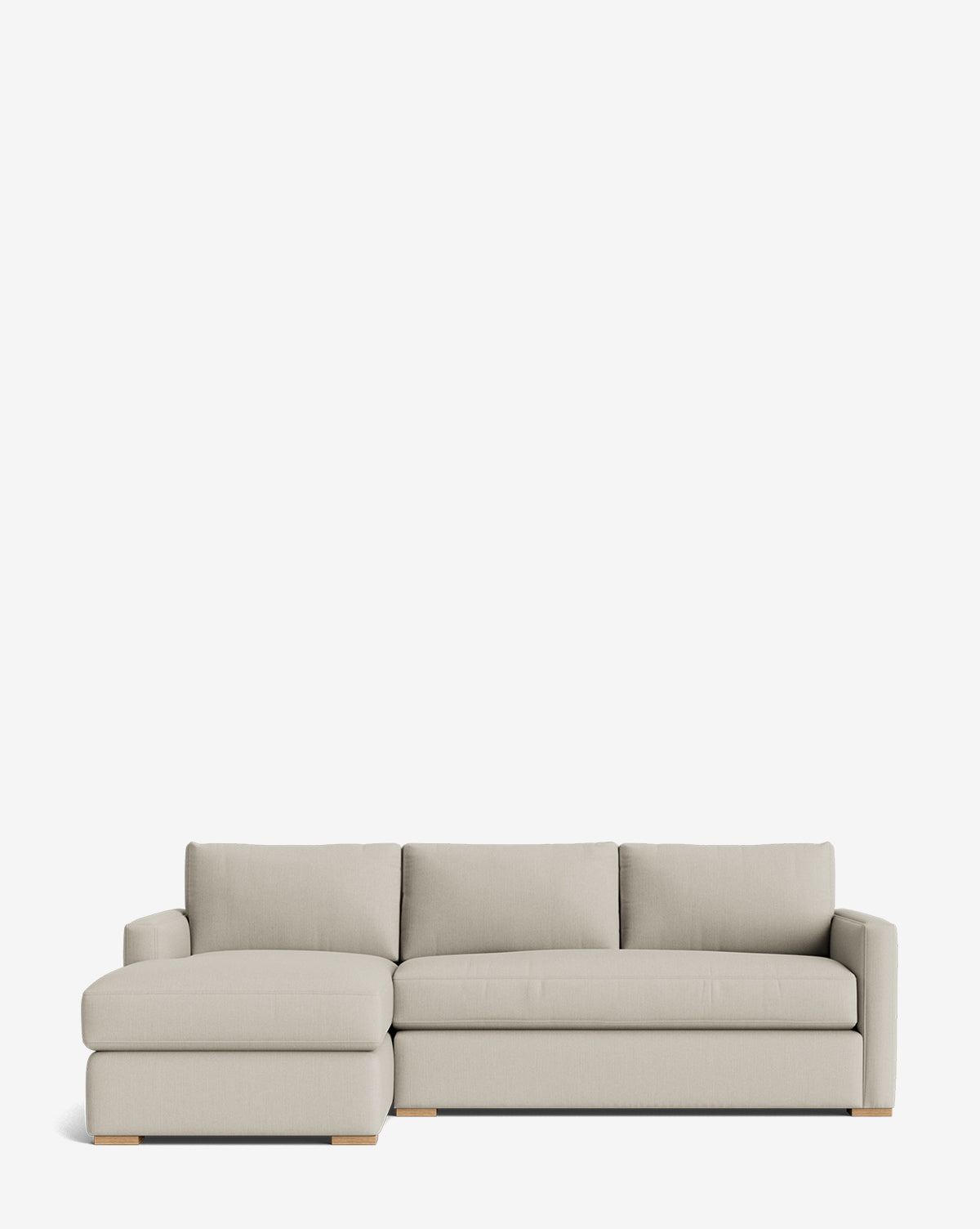 The Macy Upholstered Chaise Sectional 101 is a modern light beige sofa with a left-side chaise, three seat cushions, and wide armrests, shown against a plain white background by McGee & Co.