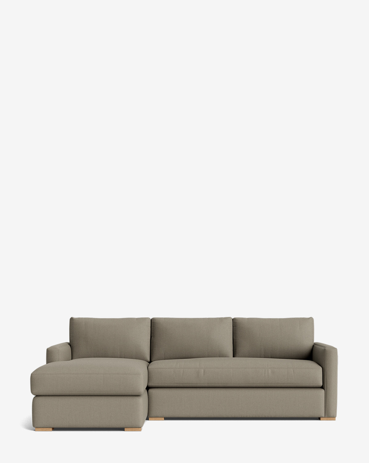 The Macy Upholstered Chaise Sectional 101 features light gray upholstery, a left-side chaise, and wooden block feet, shown against a plain white background for a modern living room look, by McGee & Co.