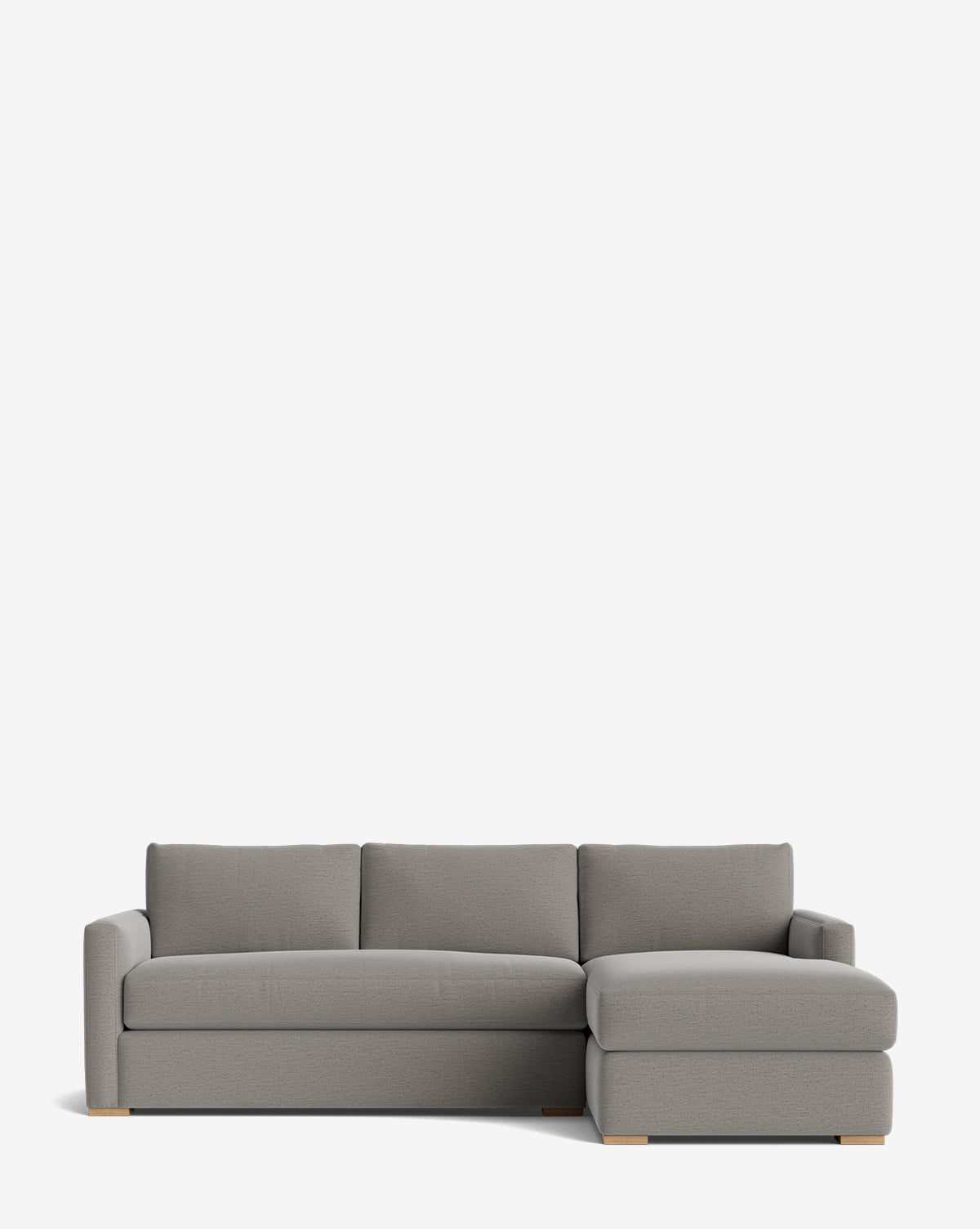The Macy Upholstered Chaise Sectional 101 features a modern gray design with a right-facing chaise, low armrests, and wooden block feet—an ideal stylish addition for your living room, shown against a plain white background by McGee & Co.