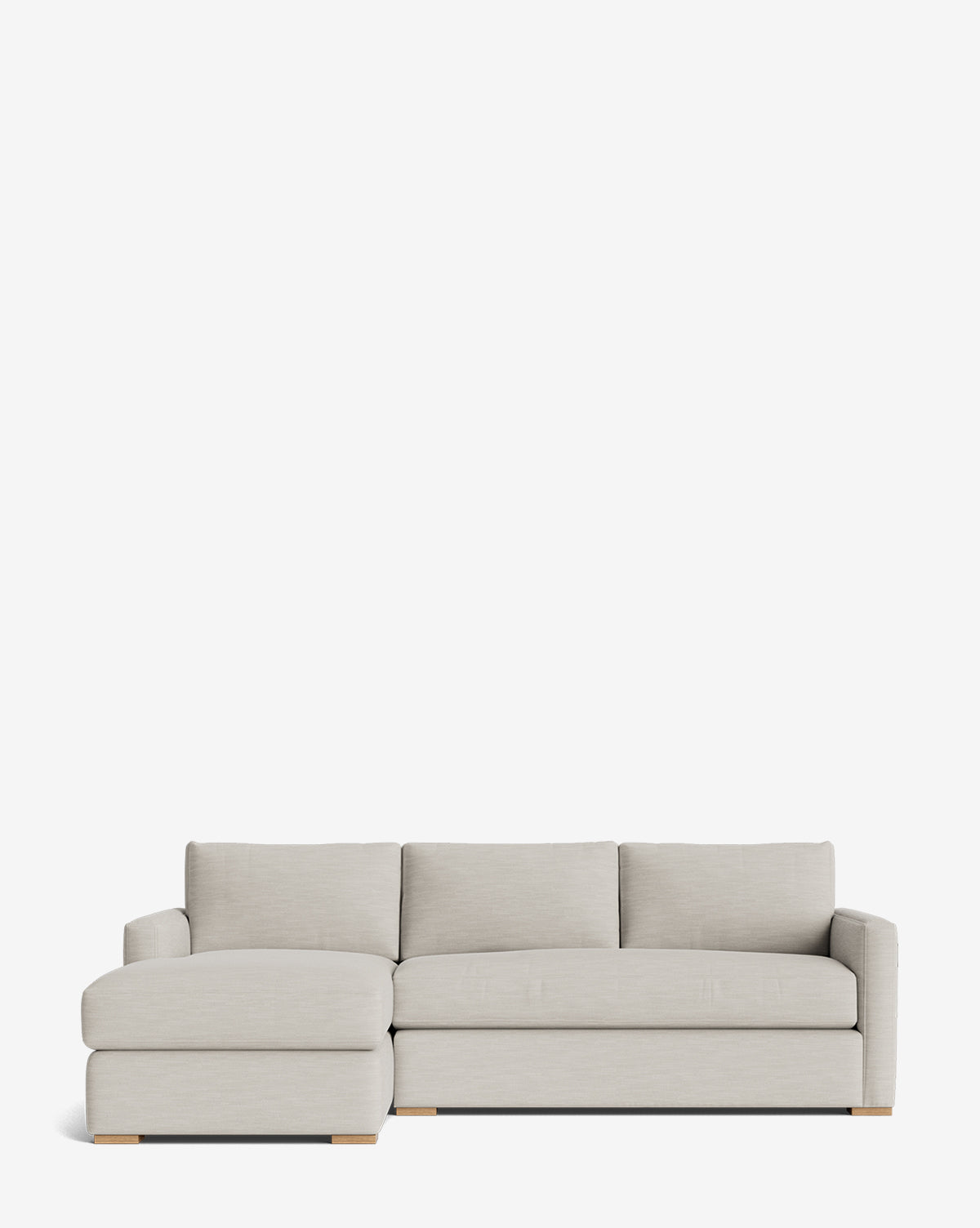 The Macy Upholstered Chaise Sectional 101 features a modern light gray design with a left-side chaise, three seat and back cushions, and low wooden block feet—ideal for contemporary living rooms, by McGee & Co.