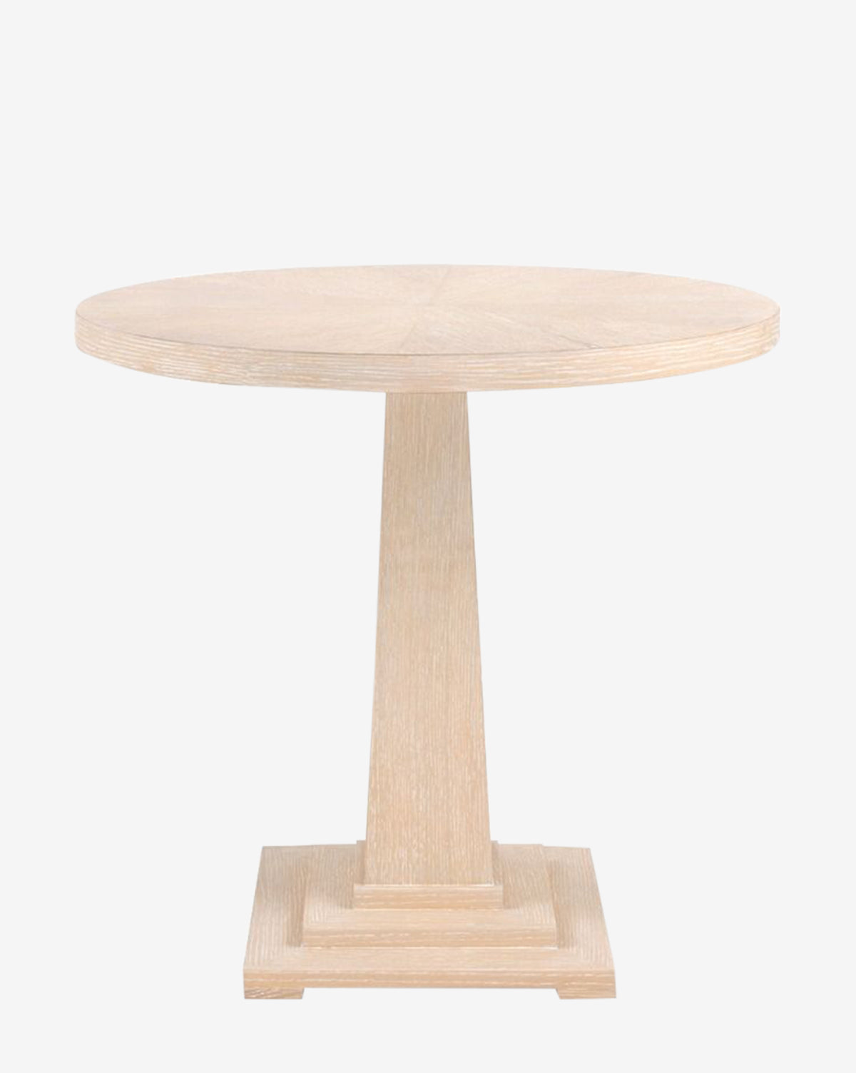 The Maddock Side Table is a round pedestal table in bleached oak, showcasing natural details with a central support and square base, set against a white background, by McGee & Co.
