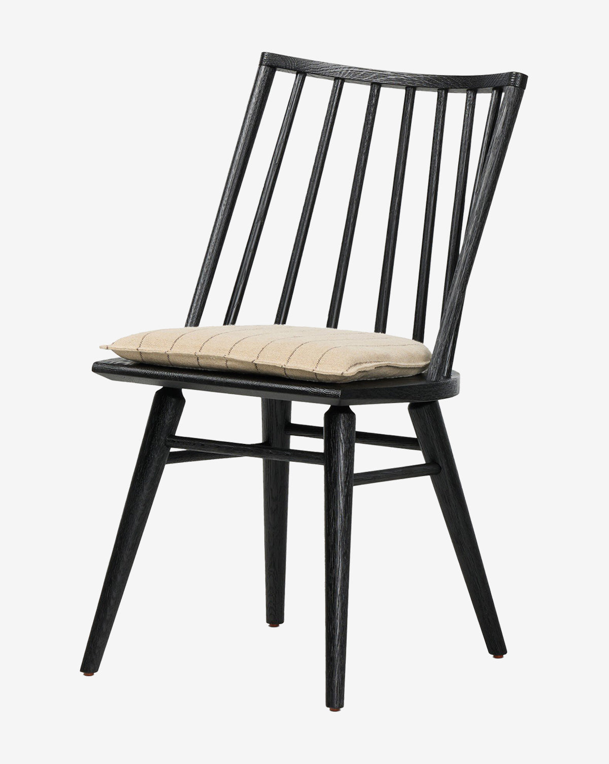 The Madison Dining Chair features a black wooden frame, slatted backrest, angled legs, and a beige cushioned seat pad. Its simple, modern design adds a contemporary touch to any dining space by McGee & Co.