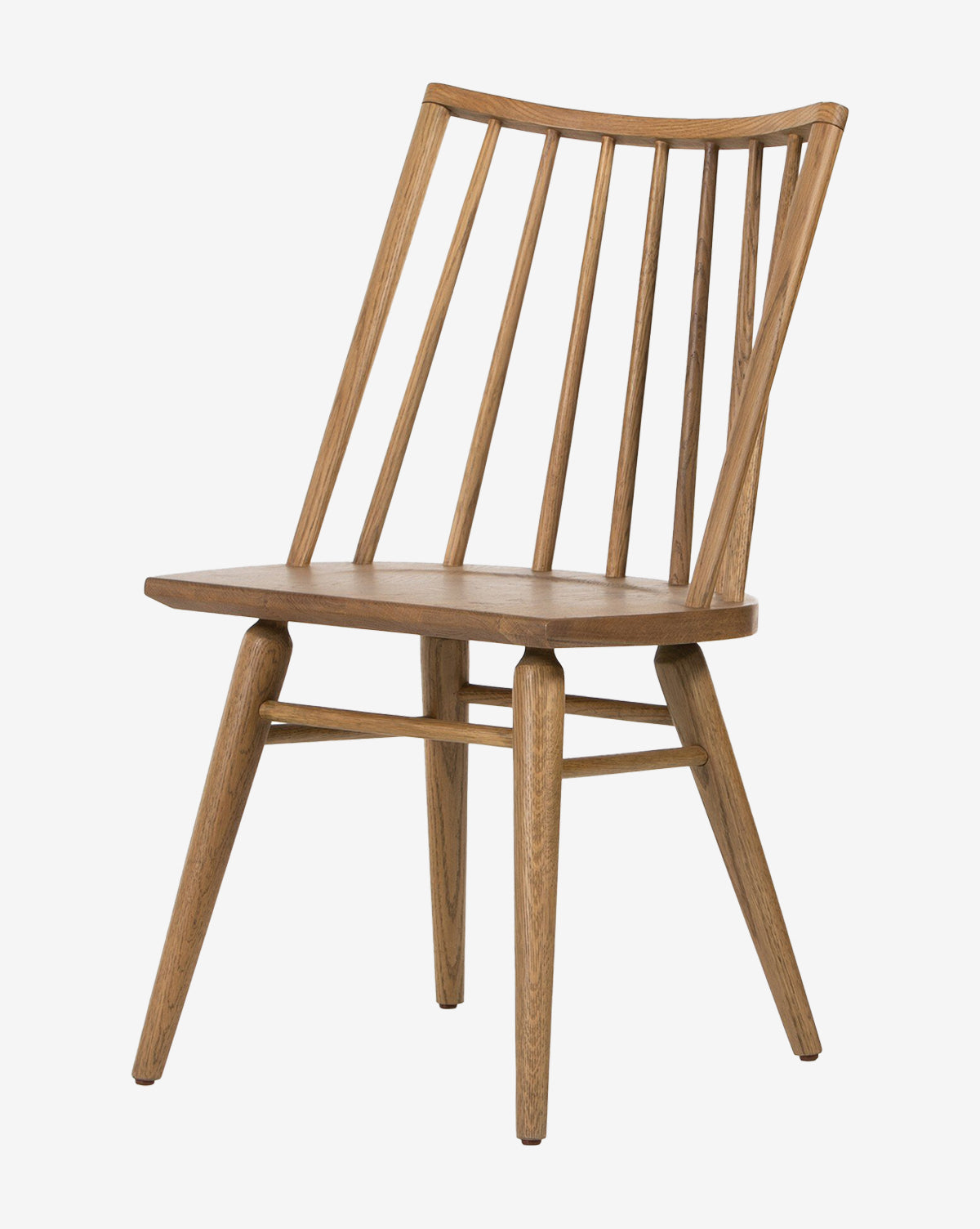 The Madison Dining Chair is a modern piece featuring a curved backrest with vertical slats, four angled legs, and a natural oak finish that complements any space, by McGee & Co.